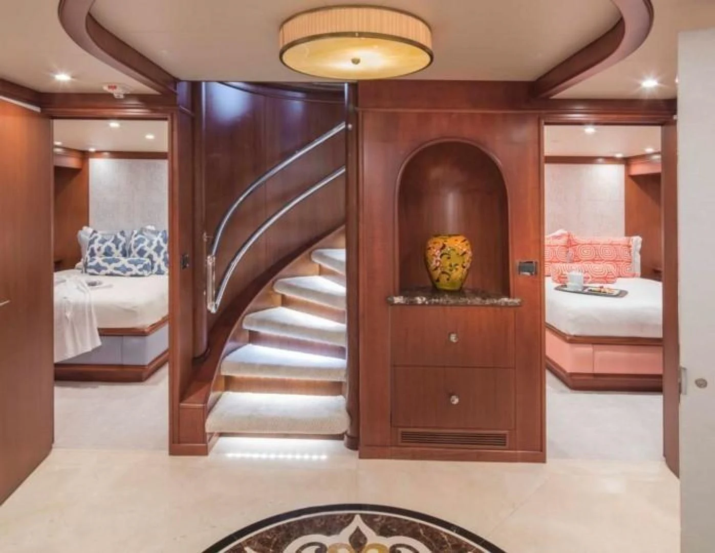 a room with a wood door and a bed aboard AT LAST Yacht for Charter
