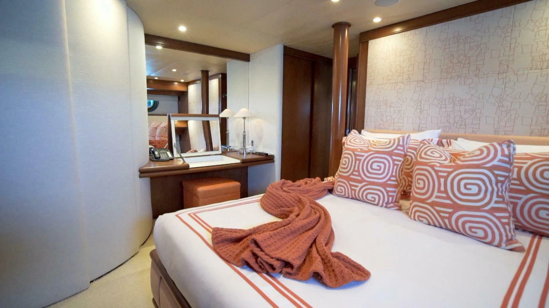 a hotel room with a bed and desk aboard AT LAST Yacht for Charter