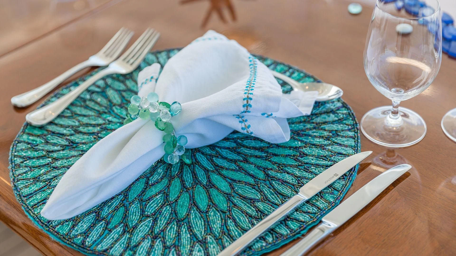 a plate with a napkin and fork on it aboard AT LAST Yacht for Charter