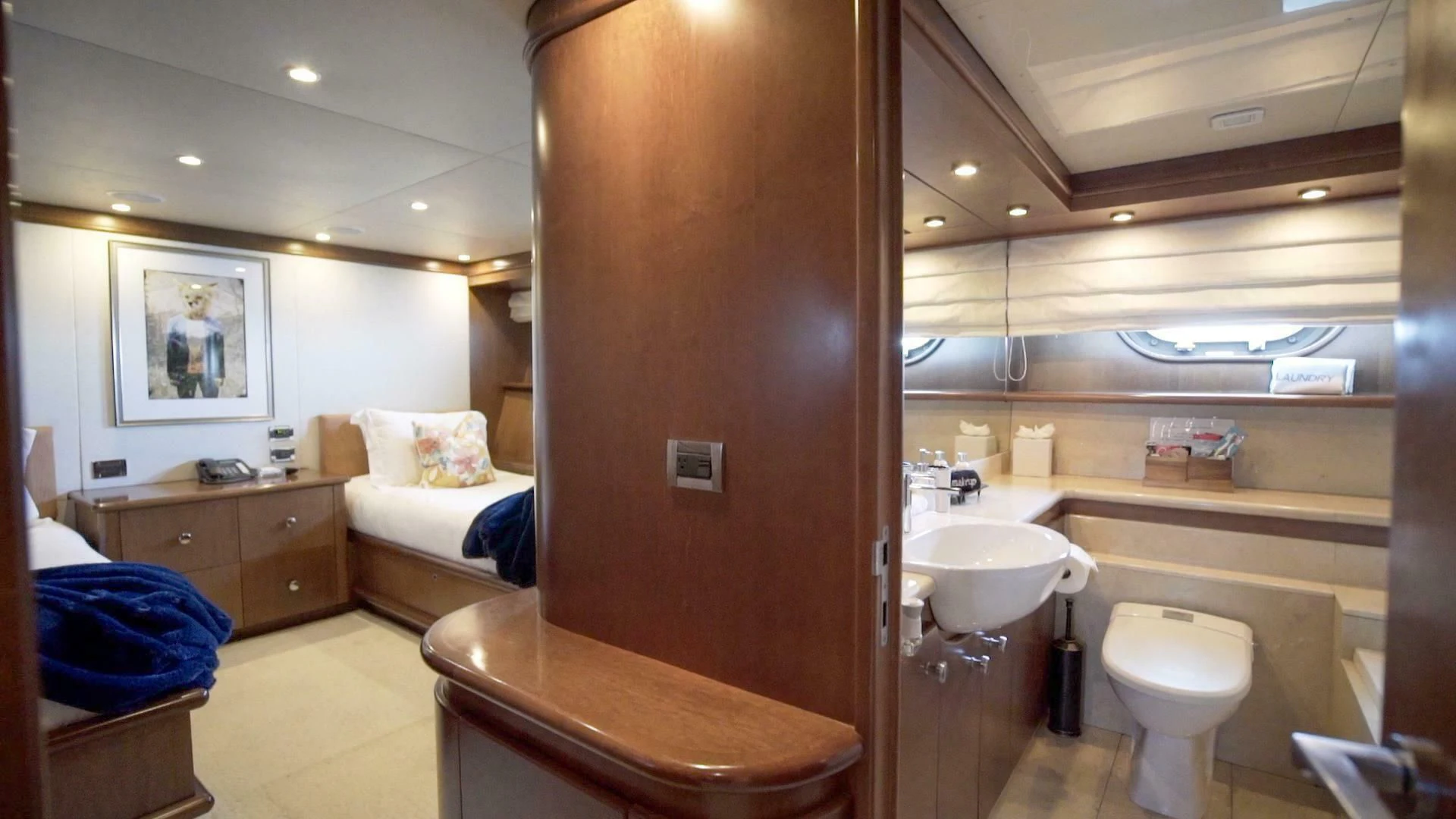 a bathroom with a toilet and sink aboard AT LAST Yacht for Charter