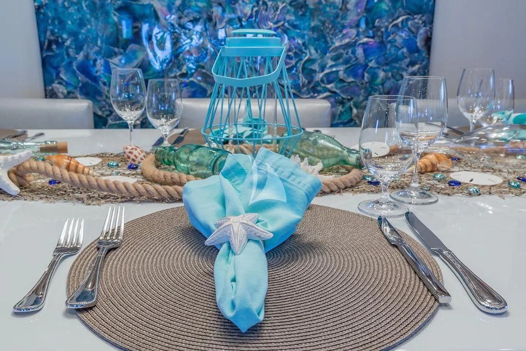 a table with food and glasses aboard AT LAST Yacht for Charter