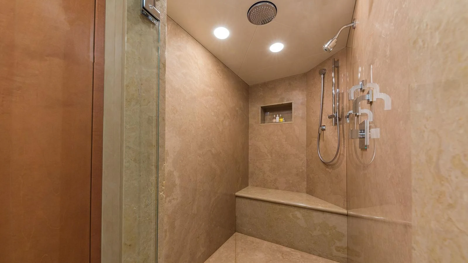 a bathroom with a shower unit aboard AT LAST Yacht for Charter