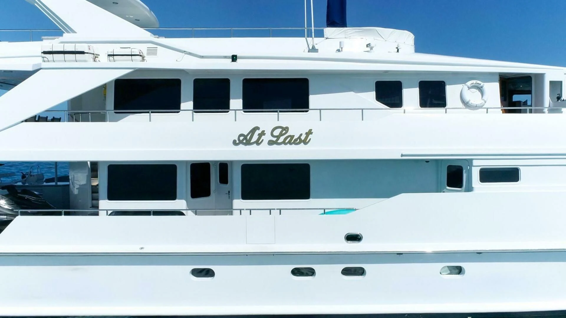 a white boat with windows aboard AT LAST Yacht for Charter
