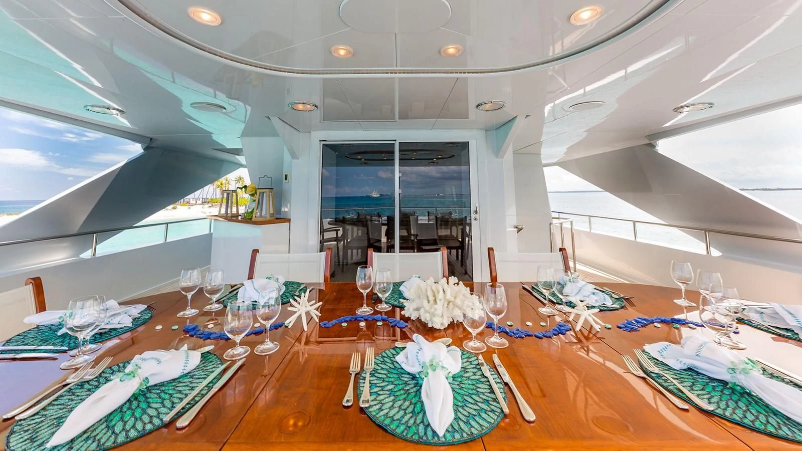 a room with tables and chairs aboard AT LAST Yacht for Charter