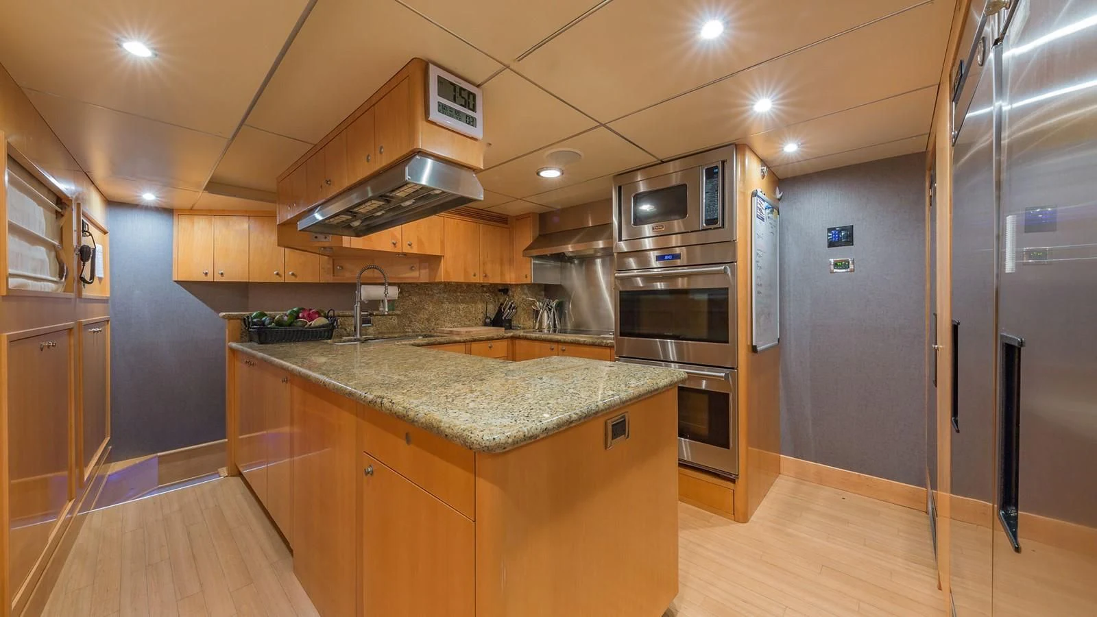 a kitchen with a stainless steel stove aboard AT LAST Yacht for Charter