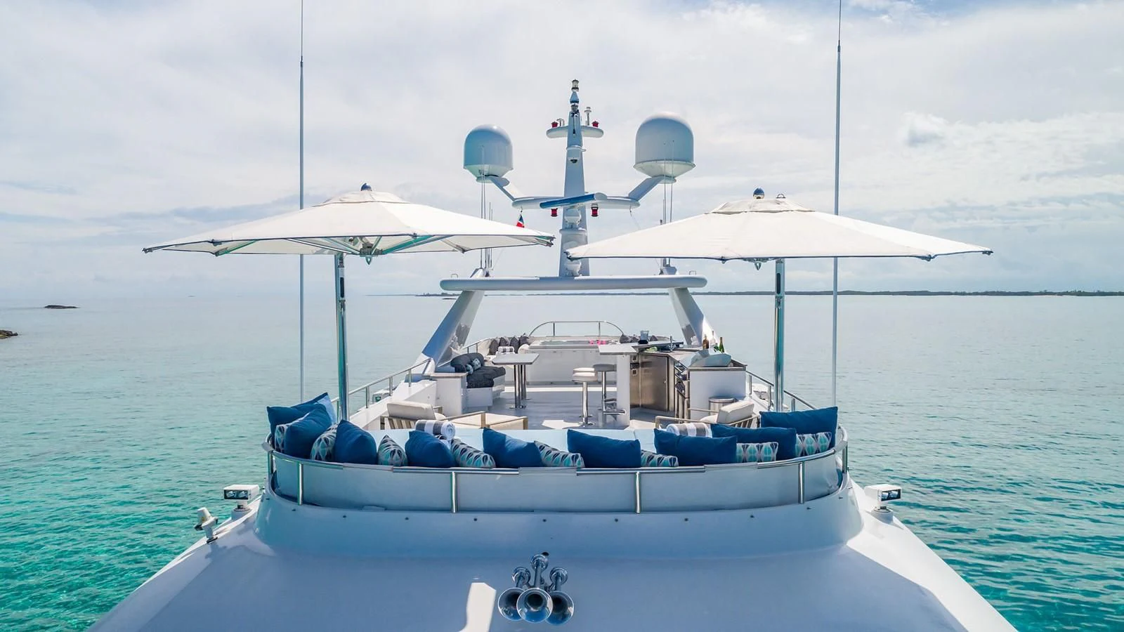 a boat with umbrellas on it aboard AT LAST Yacht for Charter