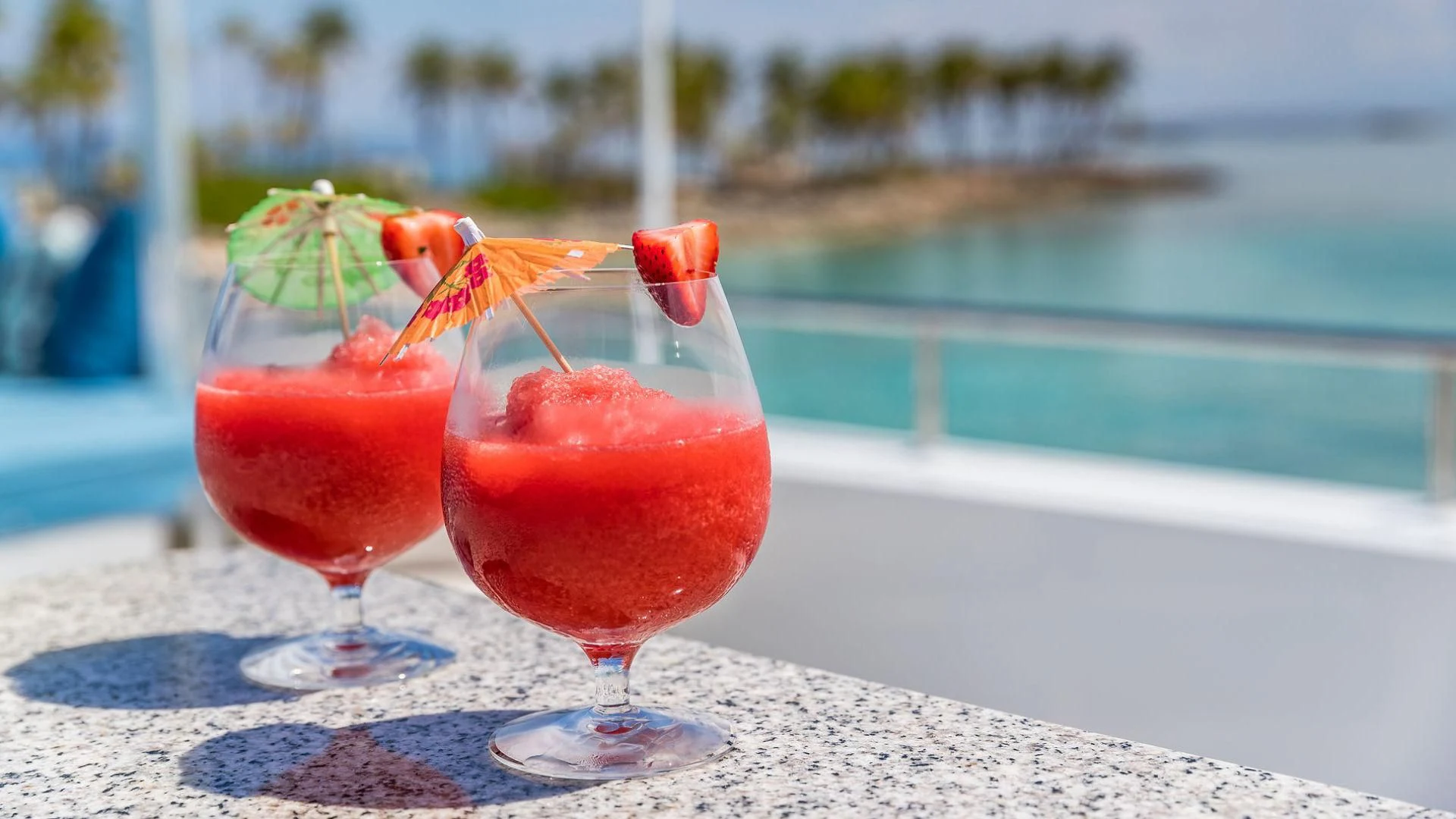 a couple of glasses with drinks on a table aboard AT LAST Yacht for Charter