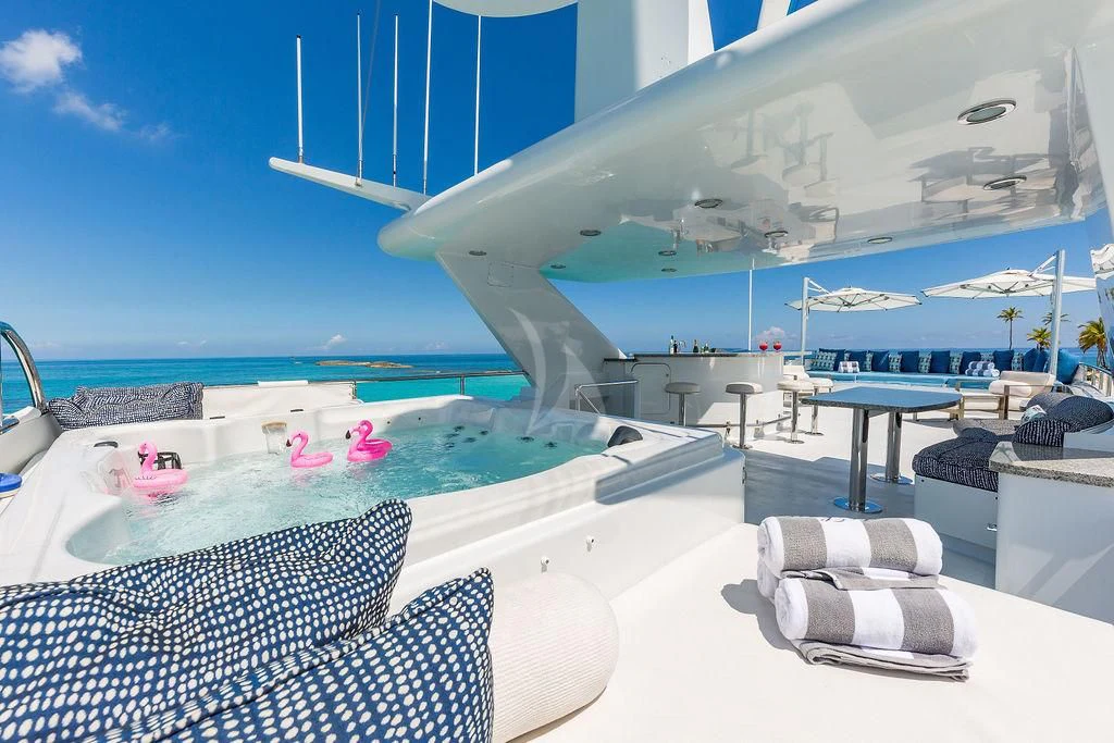 a lounge chair by a pool aboard AT LAST Yacht for Charter