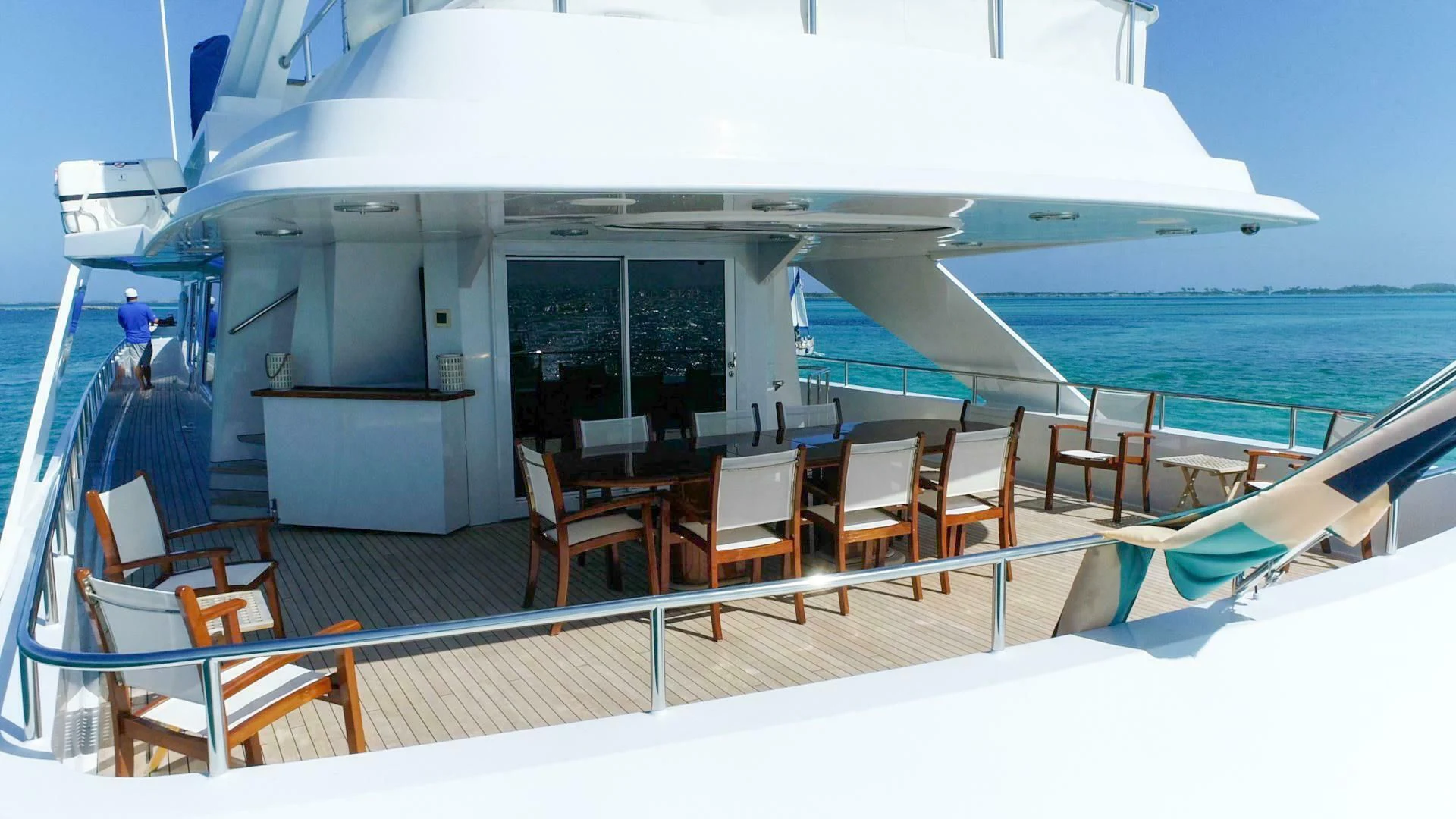 a boat with chairs on the deck aboard AT LAST Yacht for Charter