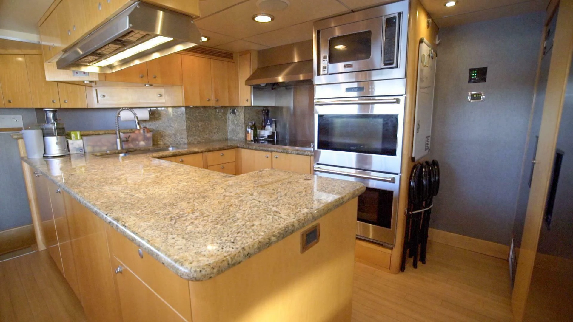a kitchen with a marble counter top aboard AT LAST Yacht for Charter