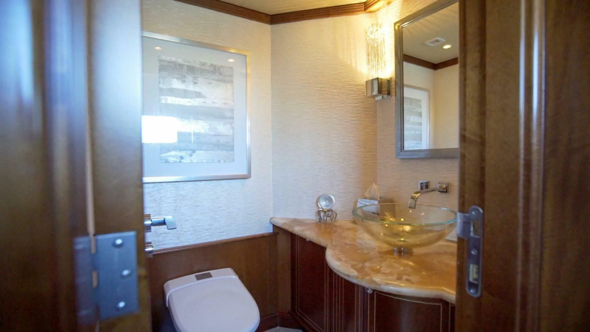 a bathroom with a sink and a mirror aboard AT LAST Yacht for Charter