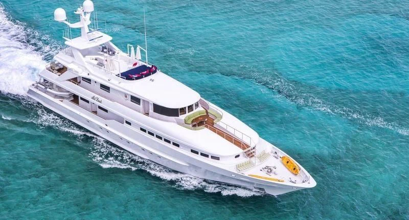 a white boat on the water aboard AT LAST Yacht for Charter
