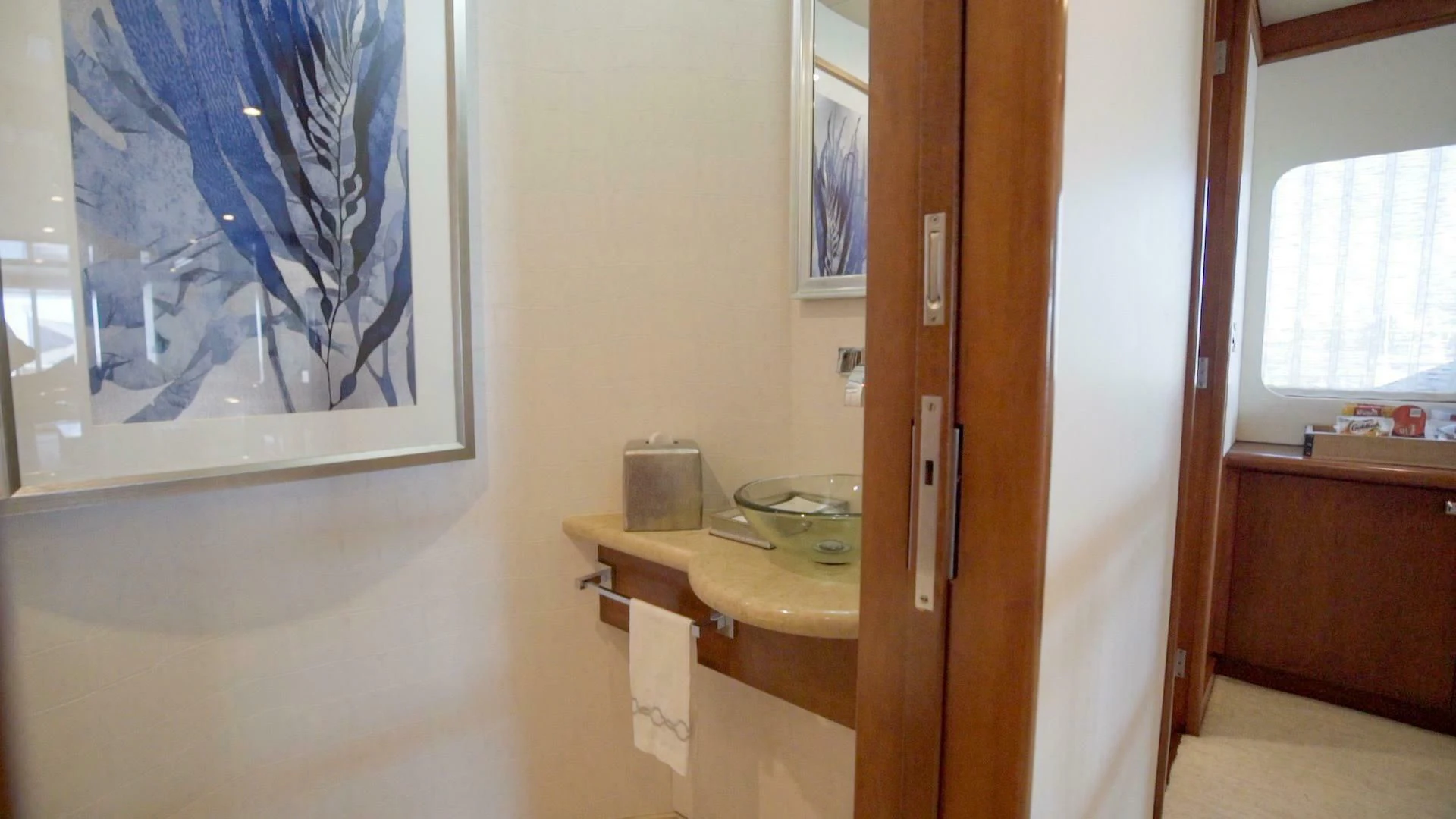 a bathroom with a painting on the wall aboard AT LAST Yacht for Charter