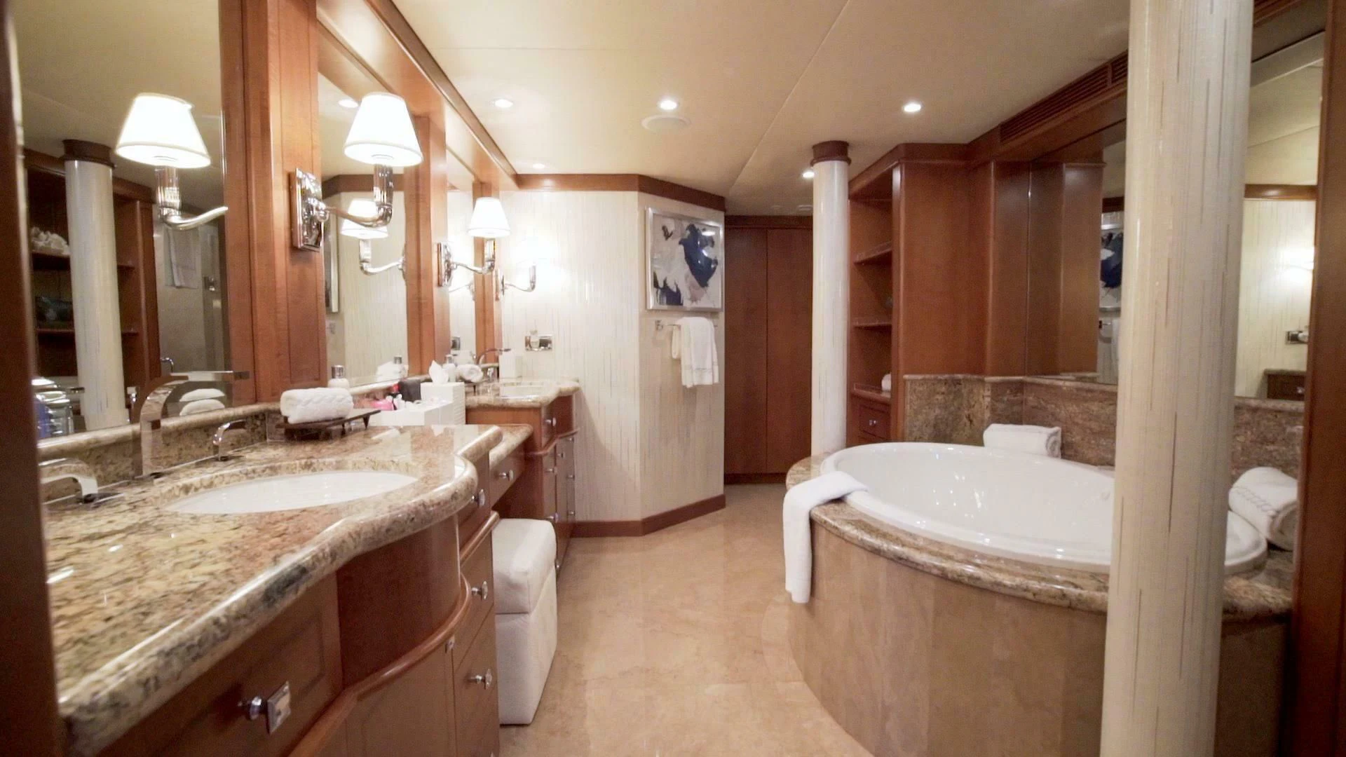 a bathroom with a tub sink and a sink aboard AT LAST Yacht for Charter