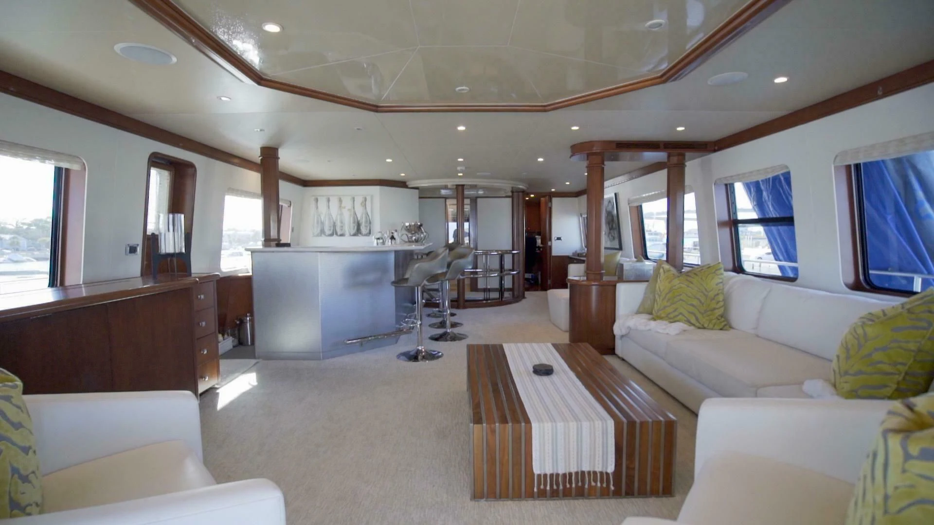 a living room with a large window aboard AT LAST Yacht for Charter
