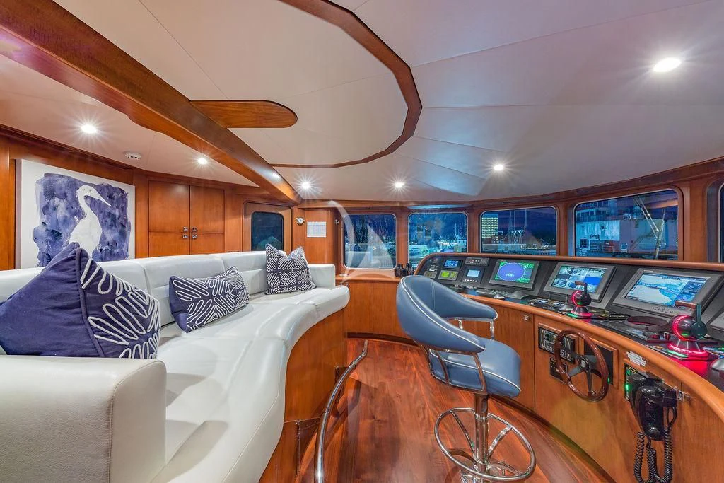 a living room with a white couch and a white sofa aboard AT LAST Yacht for Charter