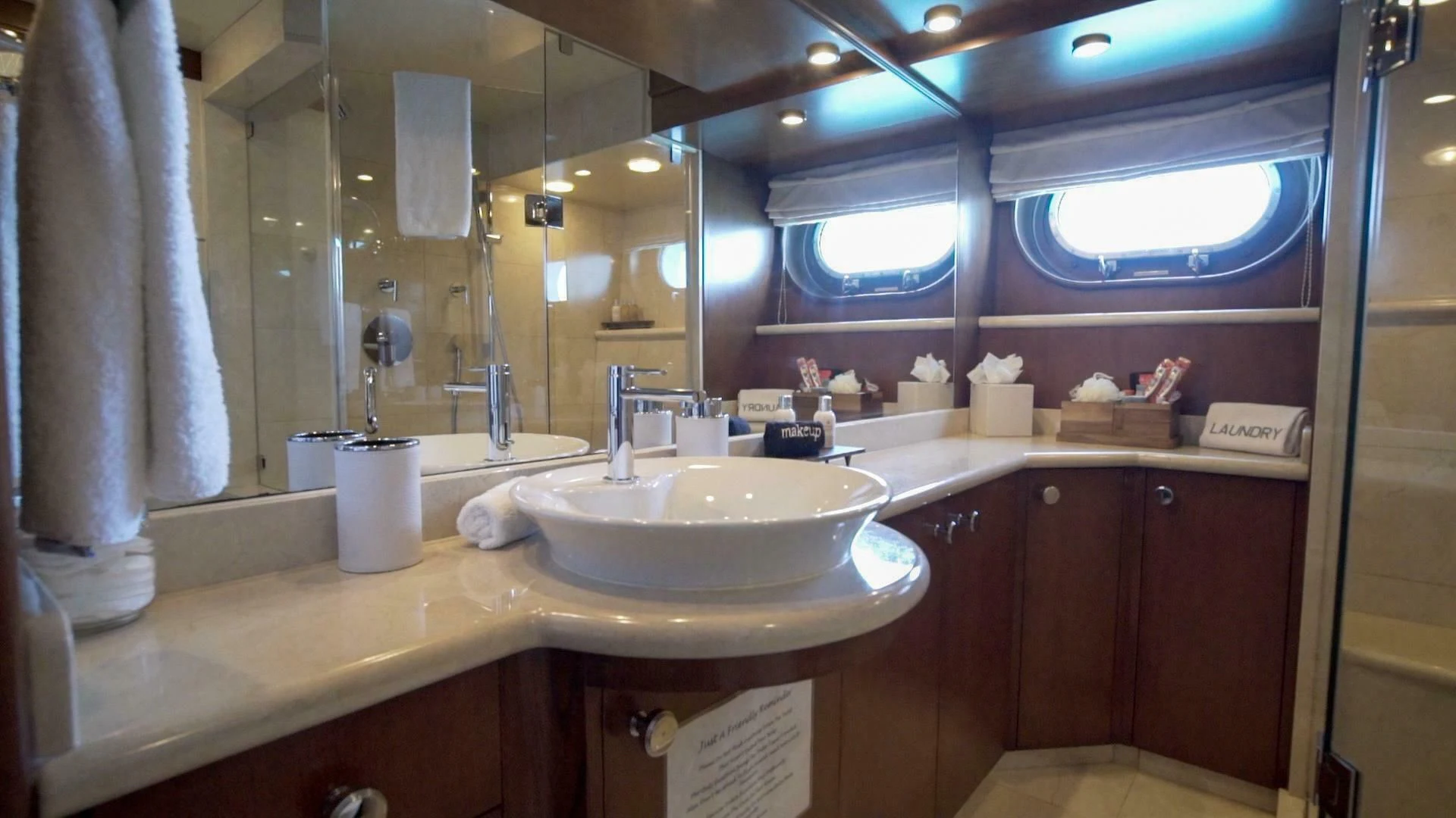 a bathroom with a large mirror aboard AT LAST Yacht for Charter