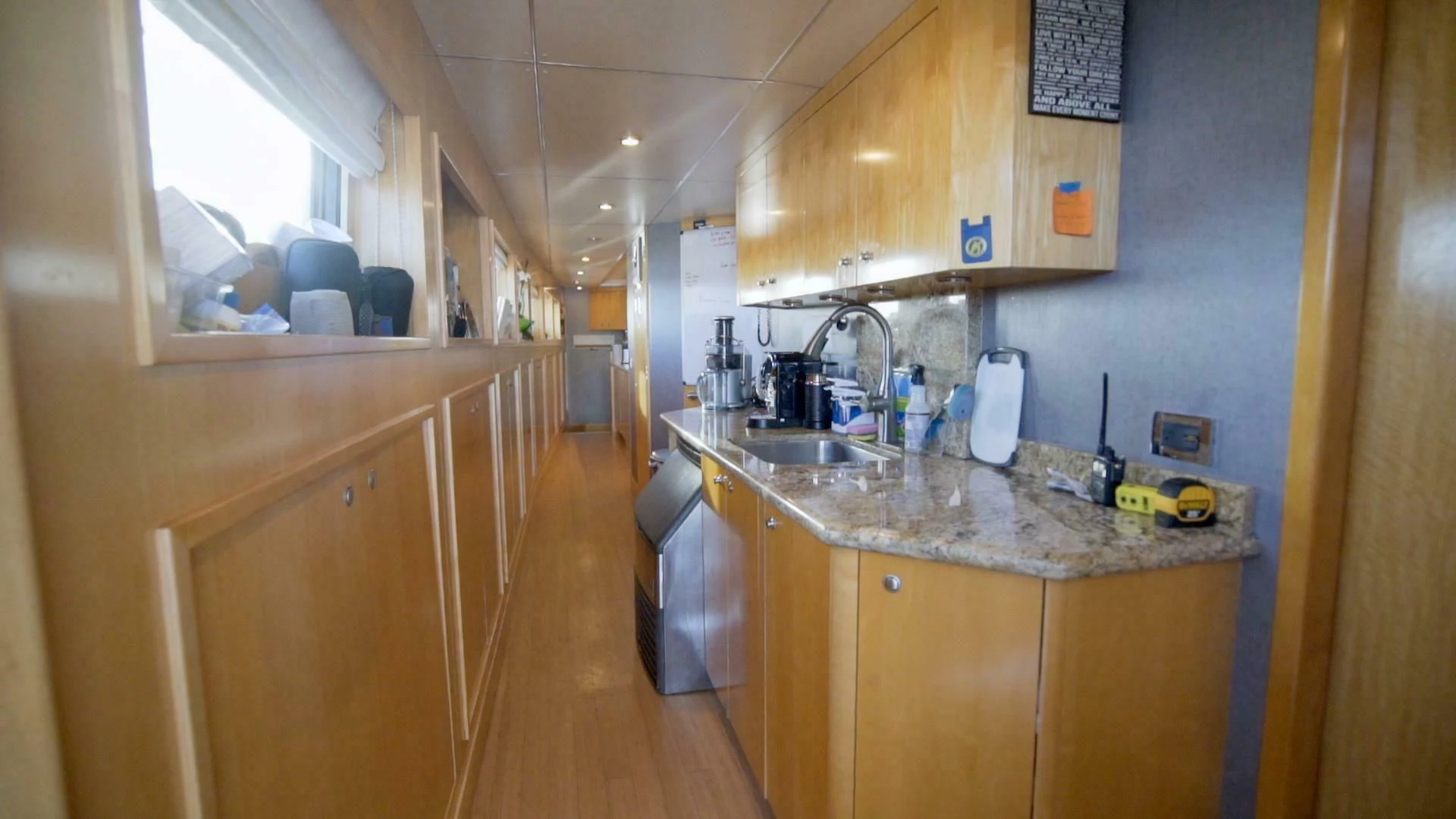 a kitchen with a sink and cabinets aboard AT LAST Yacht for Charter