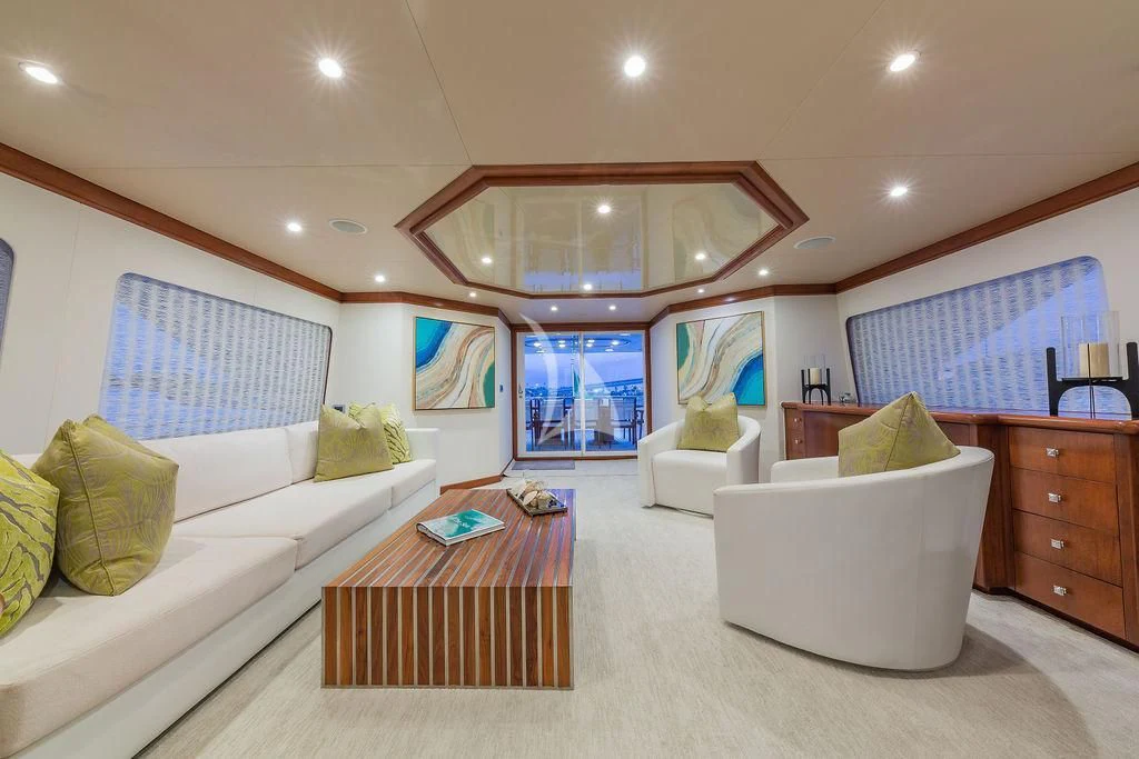 a room with a bed and a table aboard AT LAST Yacht for Charter