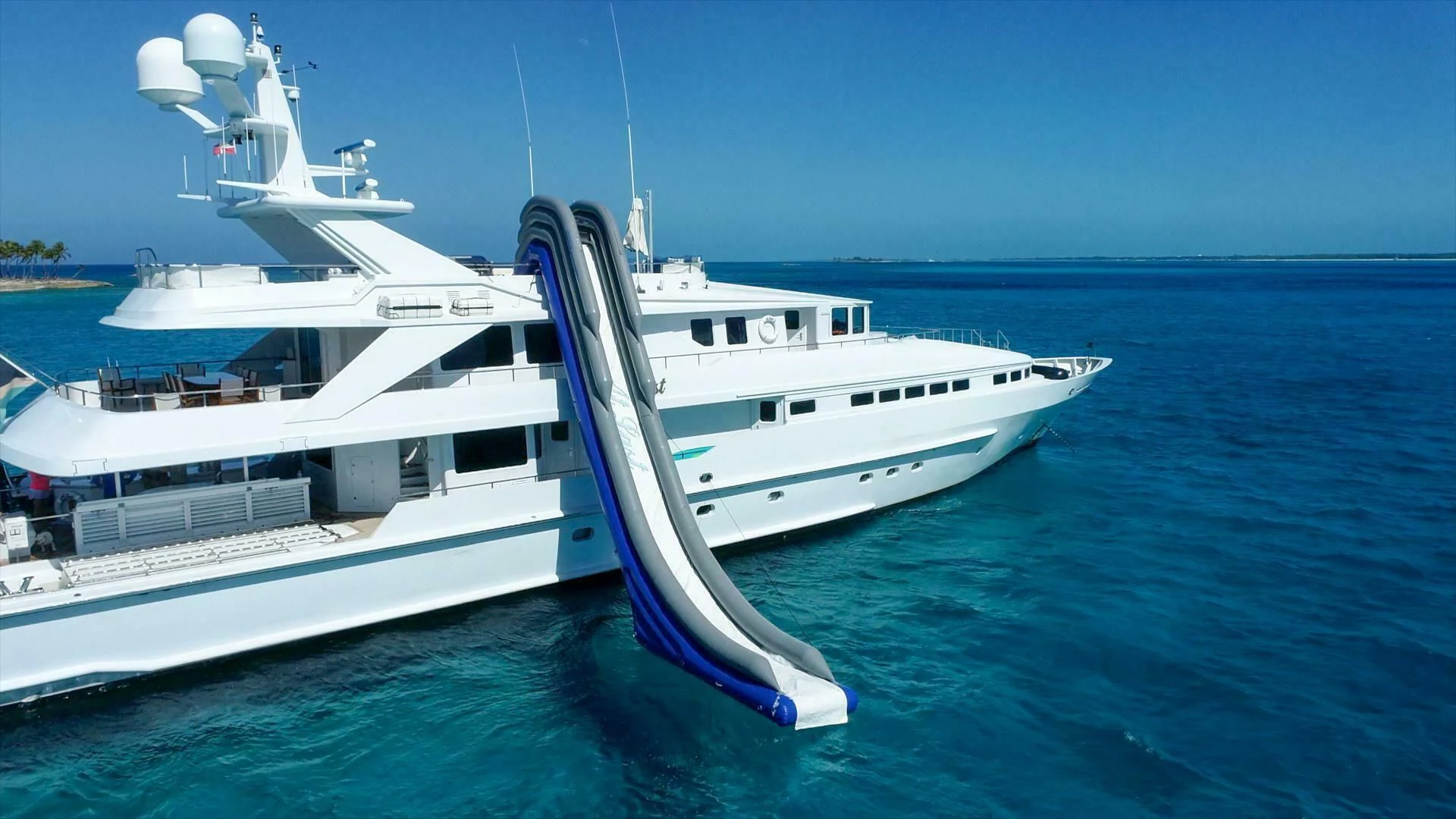 a large white boat in the water aboard AT LAST Yacht for Charter