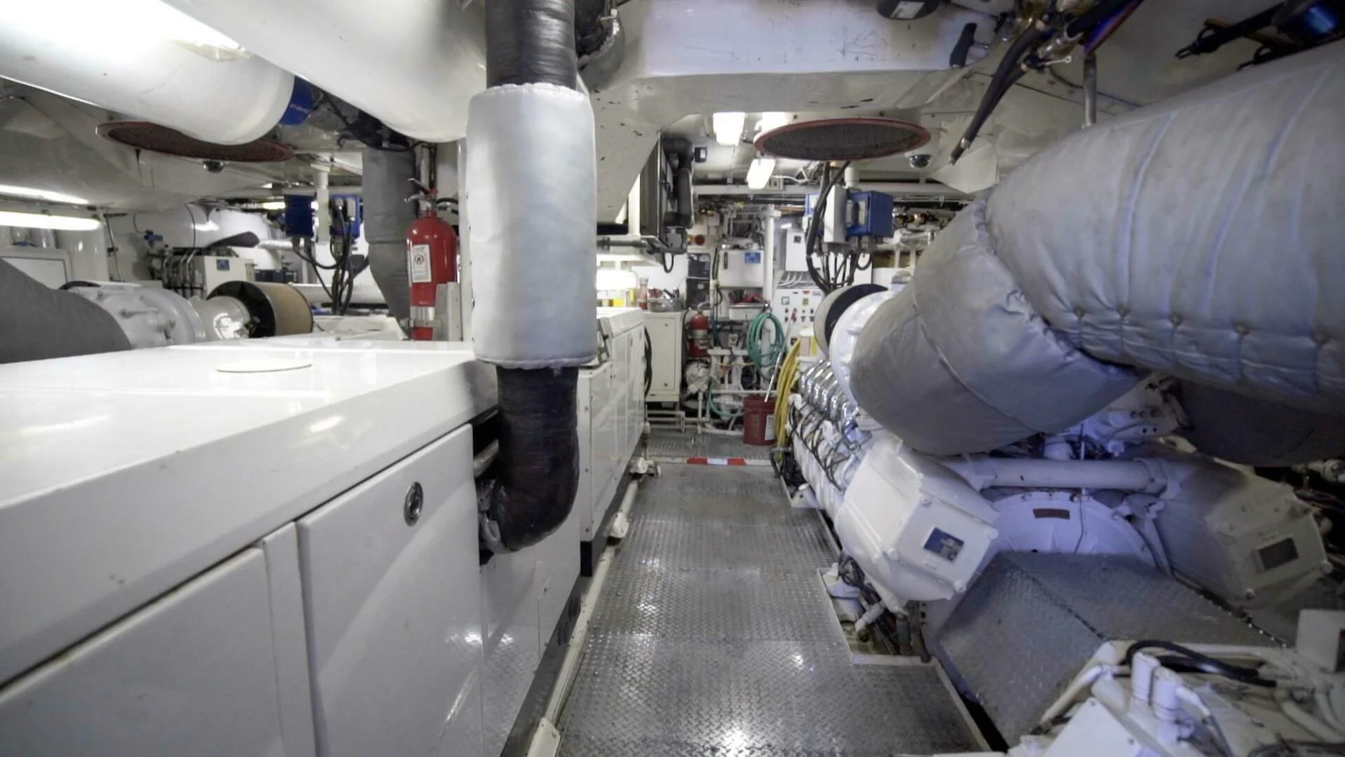 a room with machinery and pipes aboard AT LAST Yacht for Charter