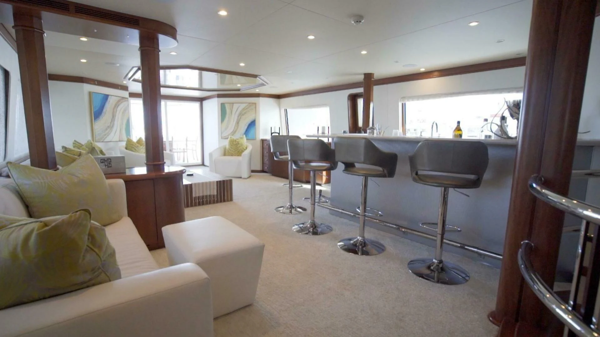 a living room with a large window aboard AT LAST Yacht for Charter