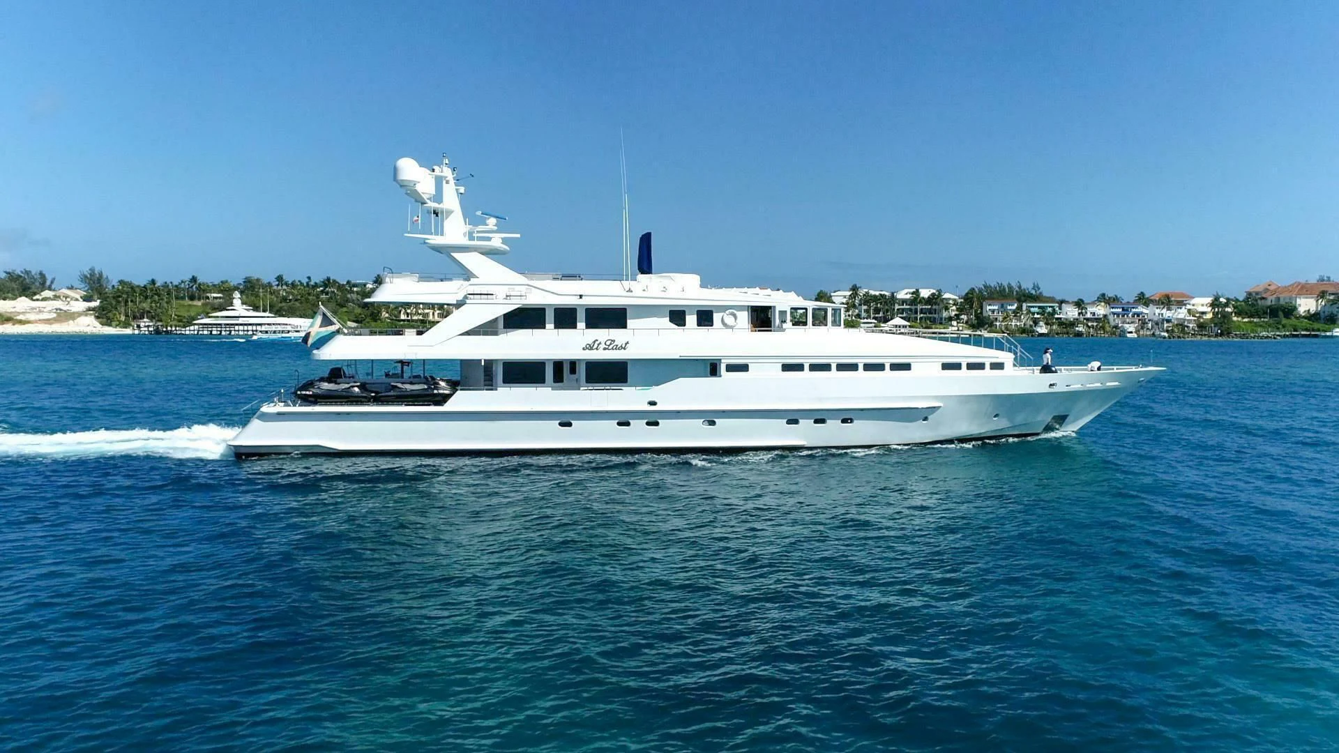 a white yacht on the water aboard AT LAST Yacht for Charter