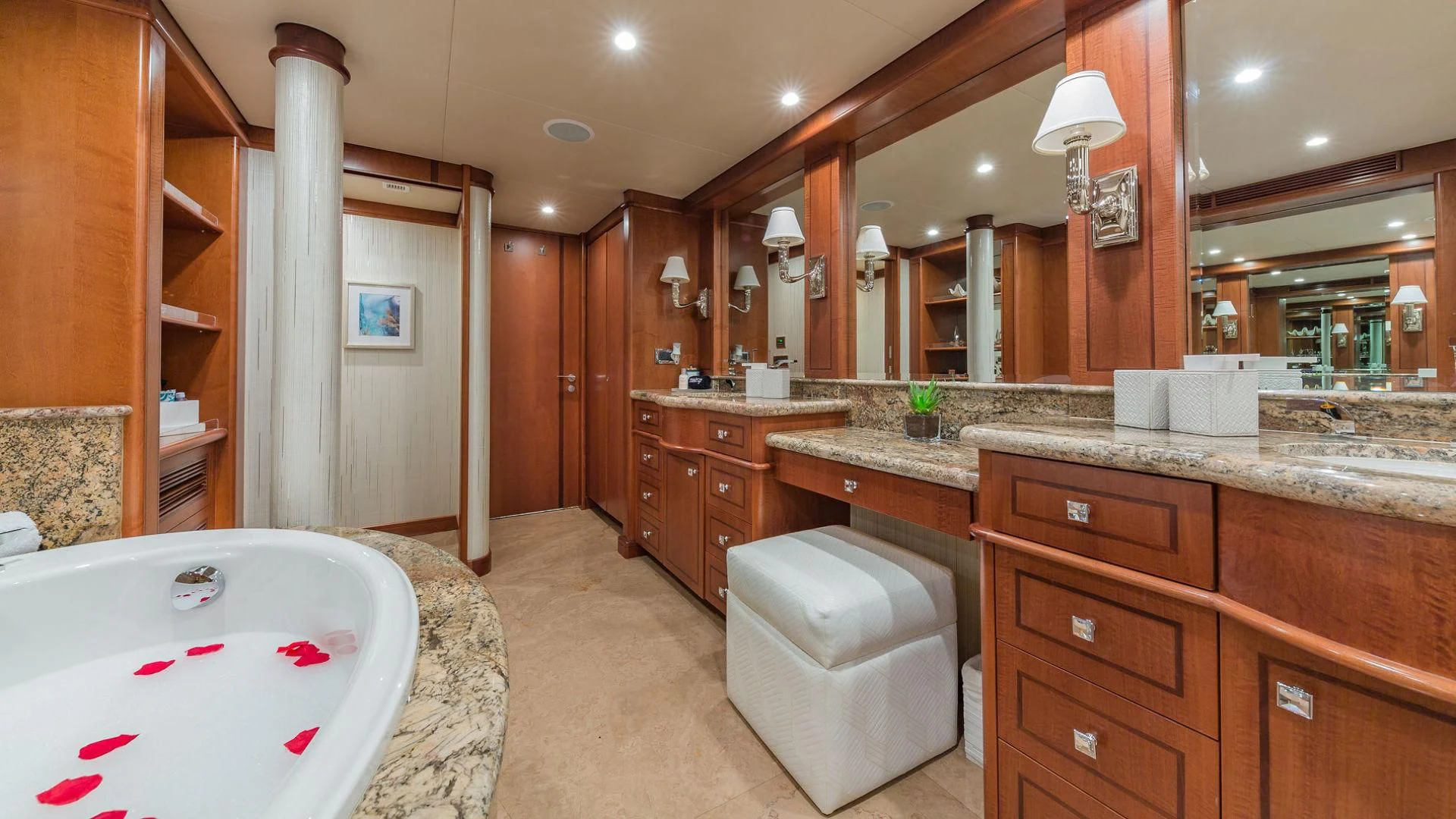 a bathroom with a tub sink and toilet aboard AT LAST Yacht for Charter