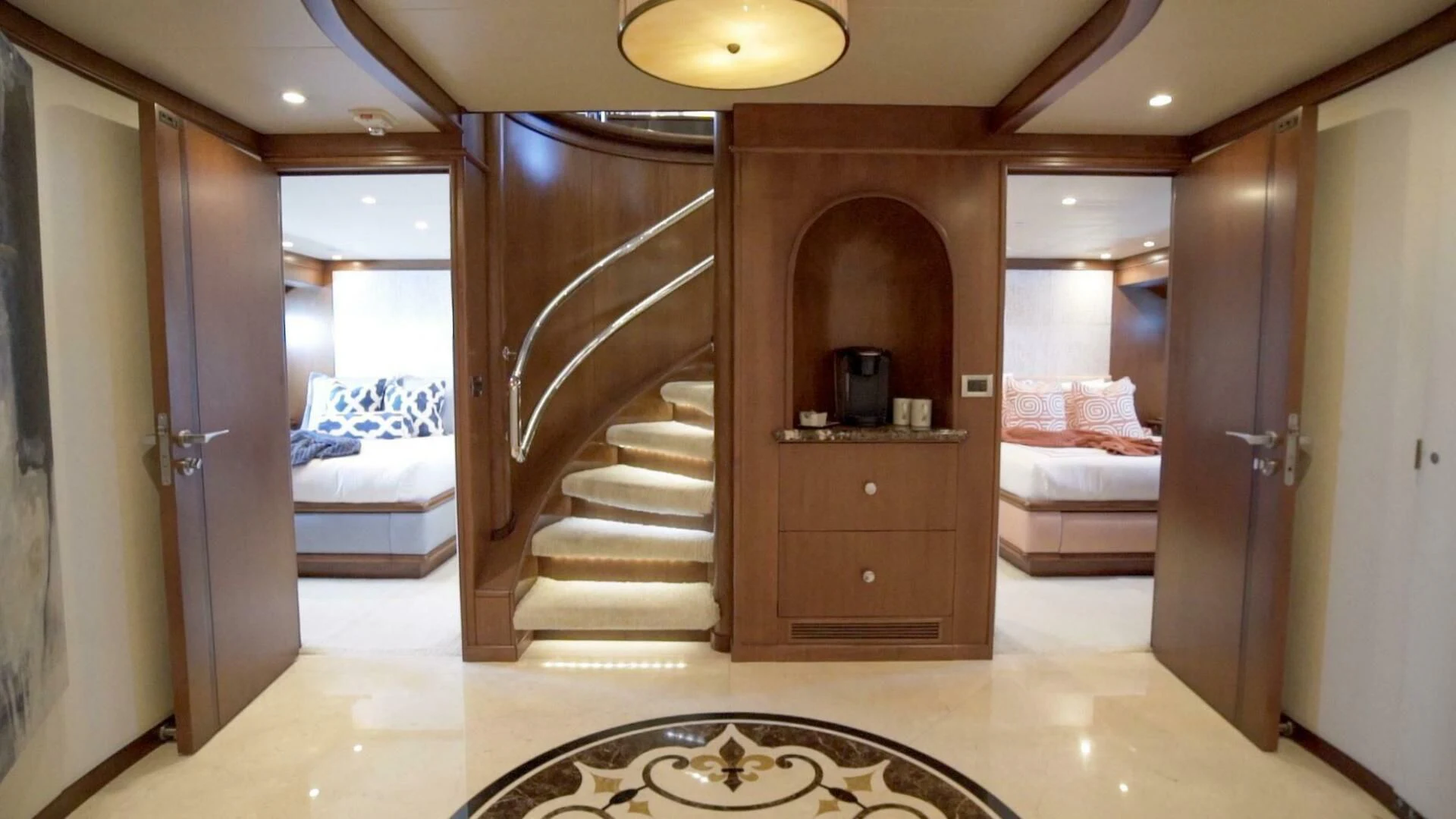 a room with a bed and a door aboard AT LAST Yacht for Charter