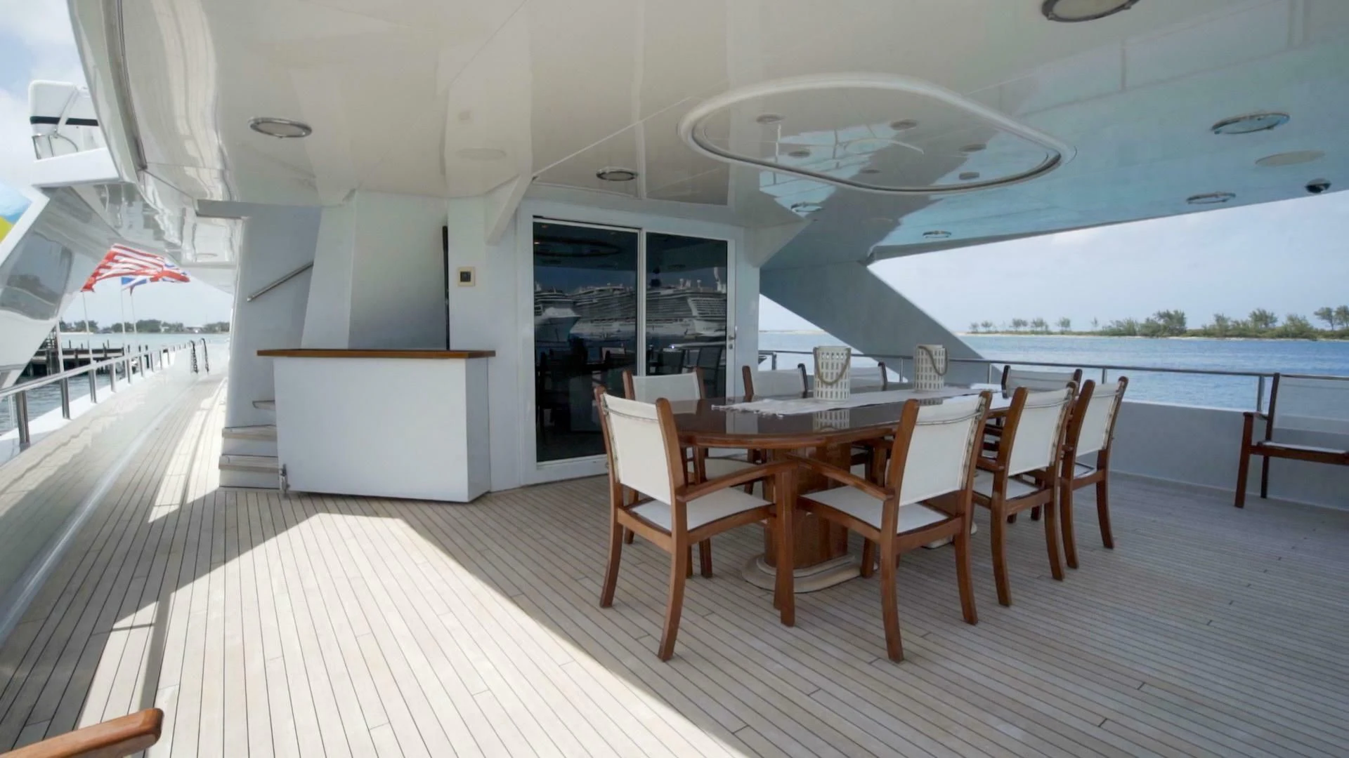a room with tables and chairs aboard AT LAST Yacht for Charter