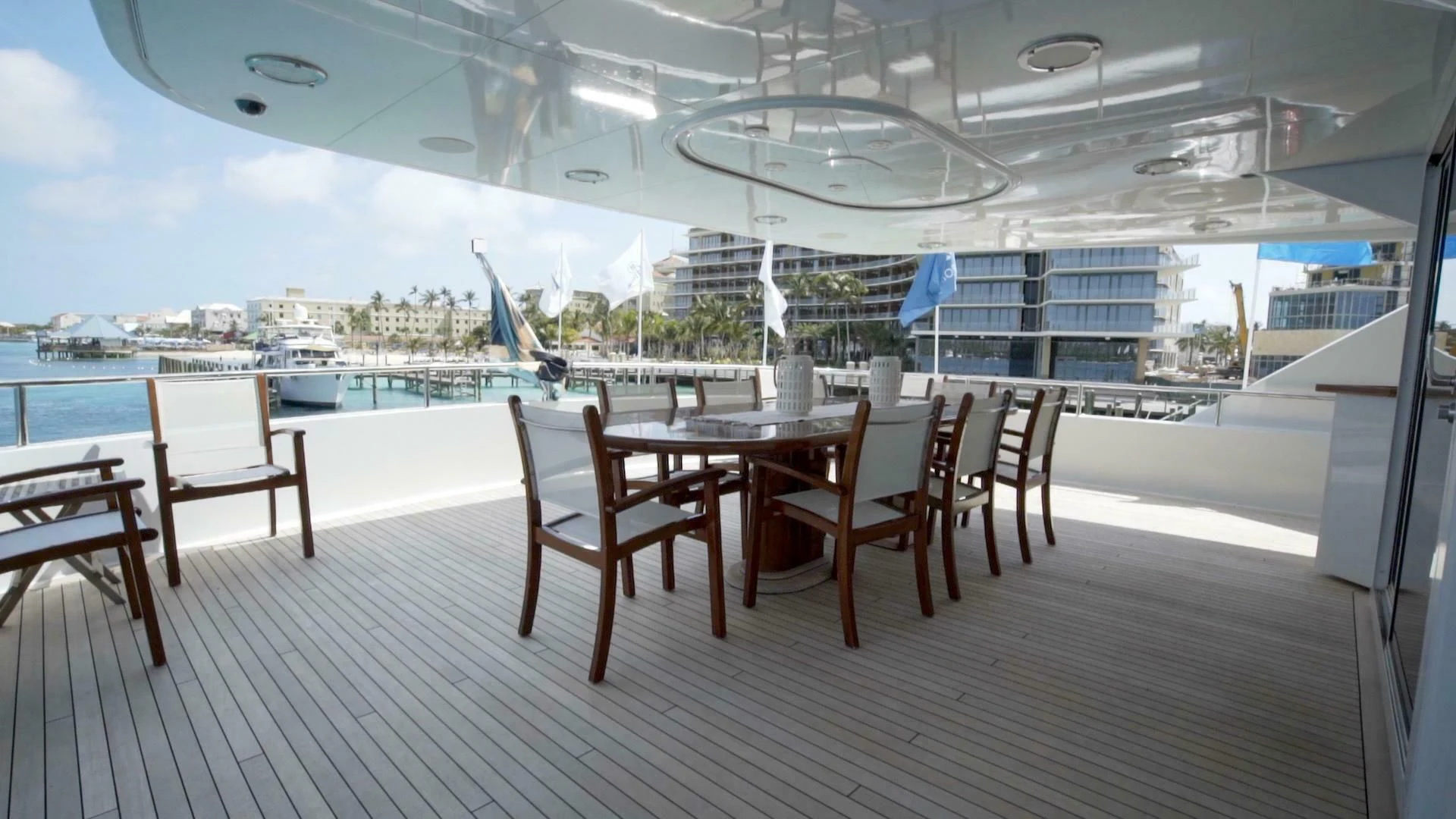a table and chairs on a deck aboard AT LAST Yacht for Charter