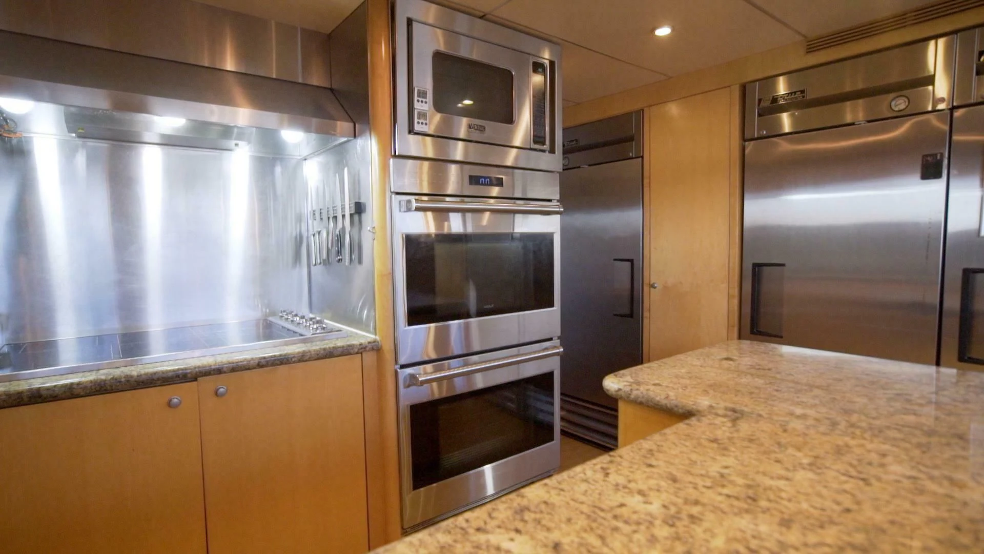 a kitchen with stainless steel appliances aboard AT LAST Yacht for Charter