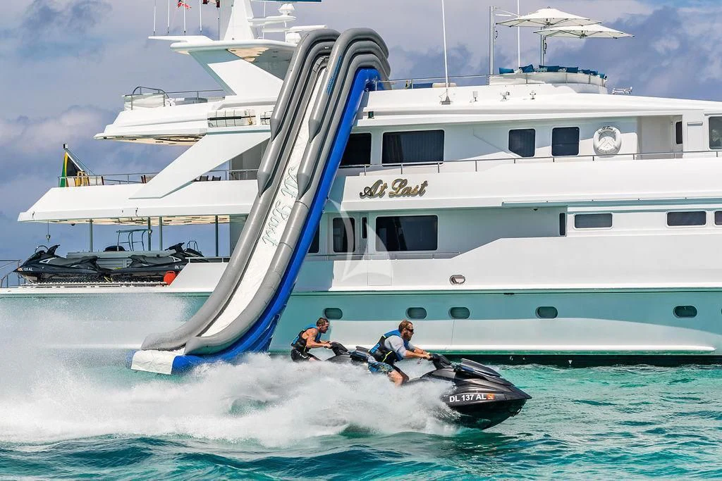 a couple of people on a boat in the water aboard AT LAST Yacht for Charter