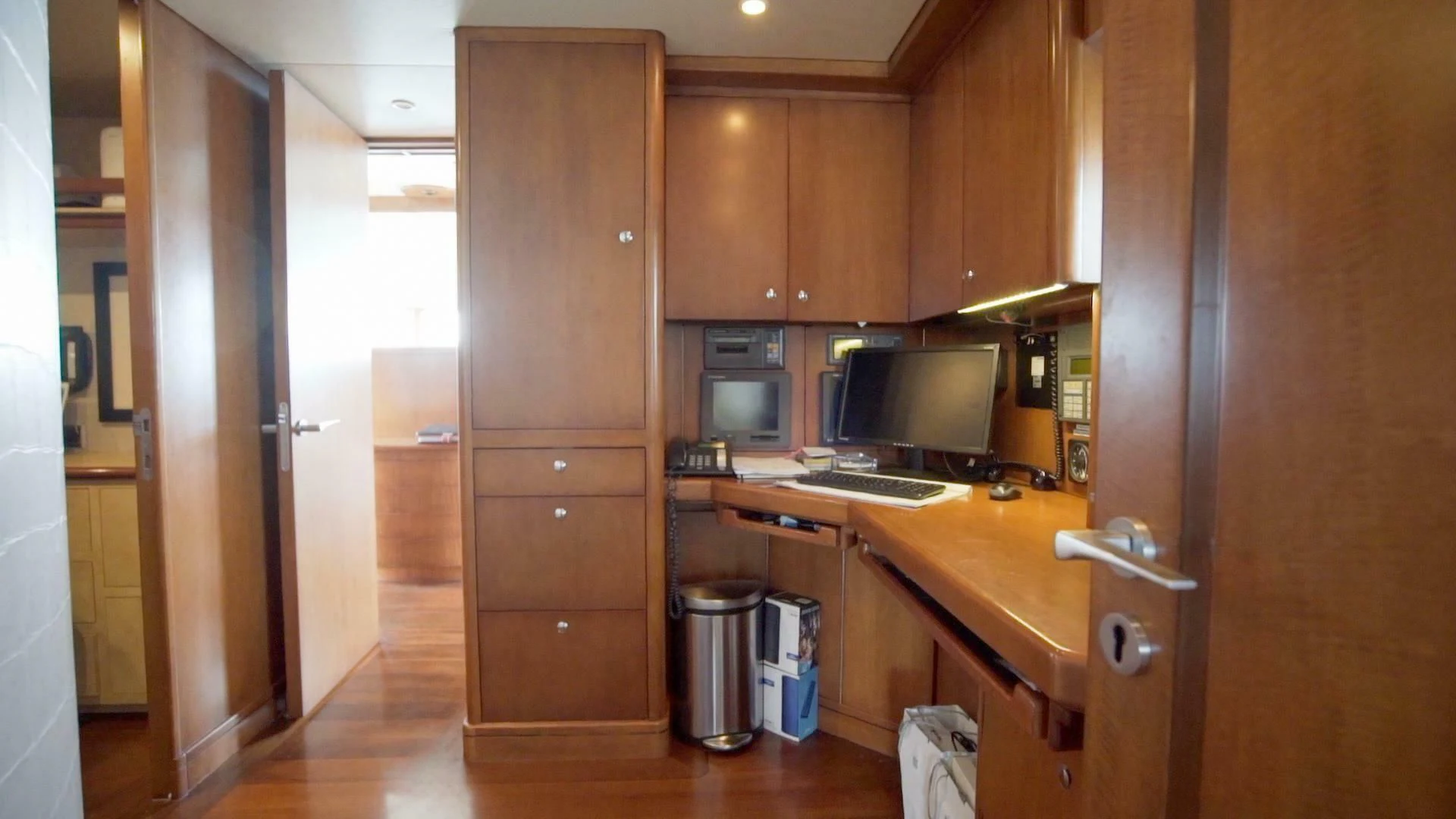 a kitchen with wooden cabinets aboard AT LAST Yacht for Charter