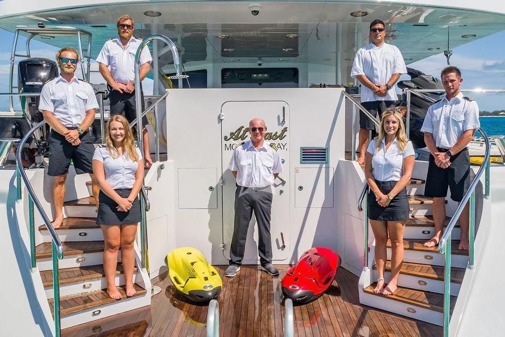 a group of people in a factory aboard AT LAST Yacht for Charter