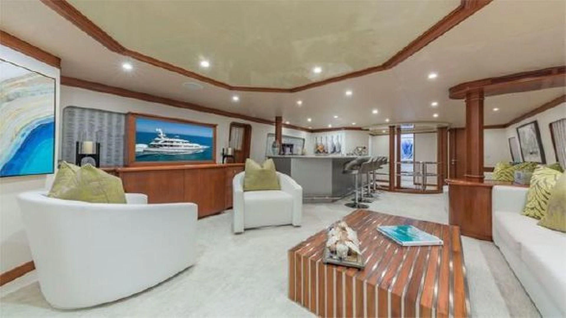 a living room with a large screen aboard AT LAST Yacht for Charter