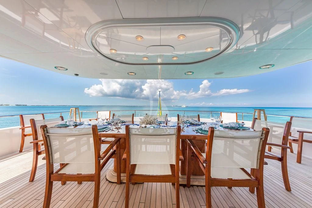 a table set for a dinner party aboard AT LAST Yacht for Charter