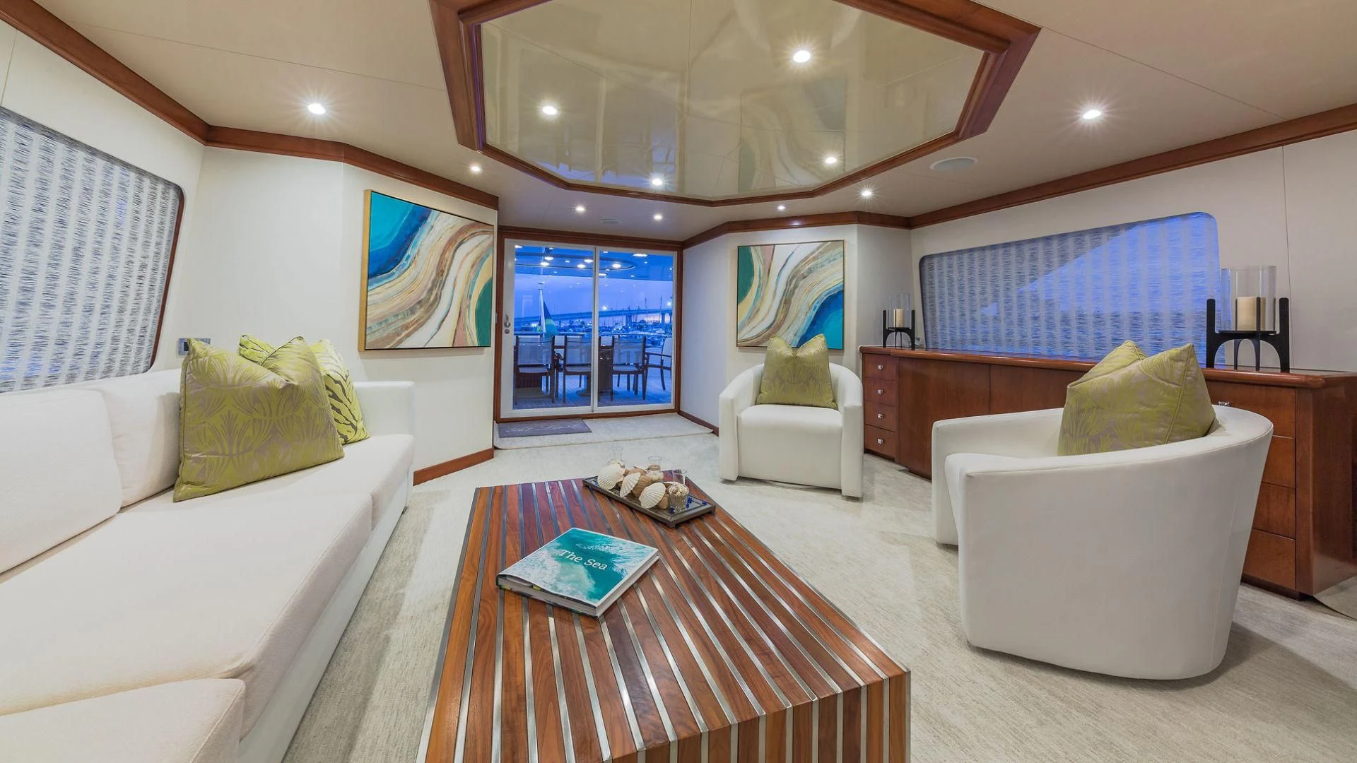 a living room with a couch and a table aboard AT LAST Yacht for Charter