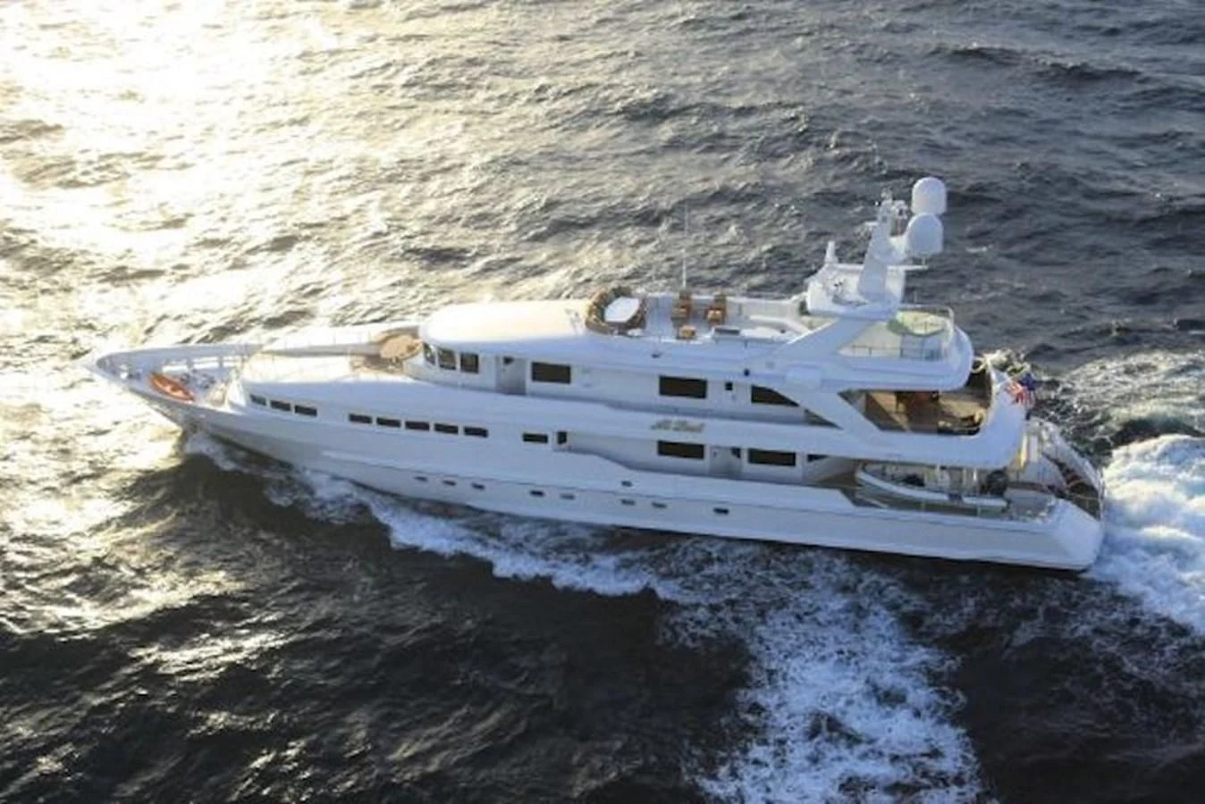 a white boat in the water aboard AT LAST Yacht for Charter