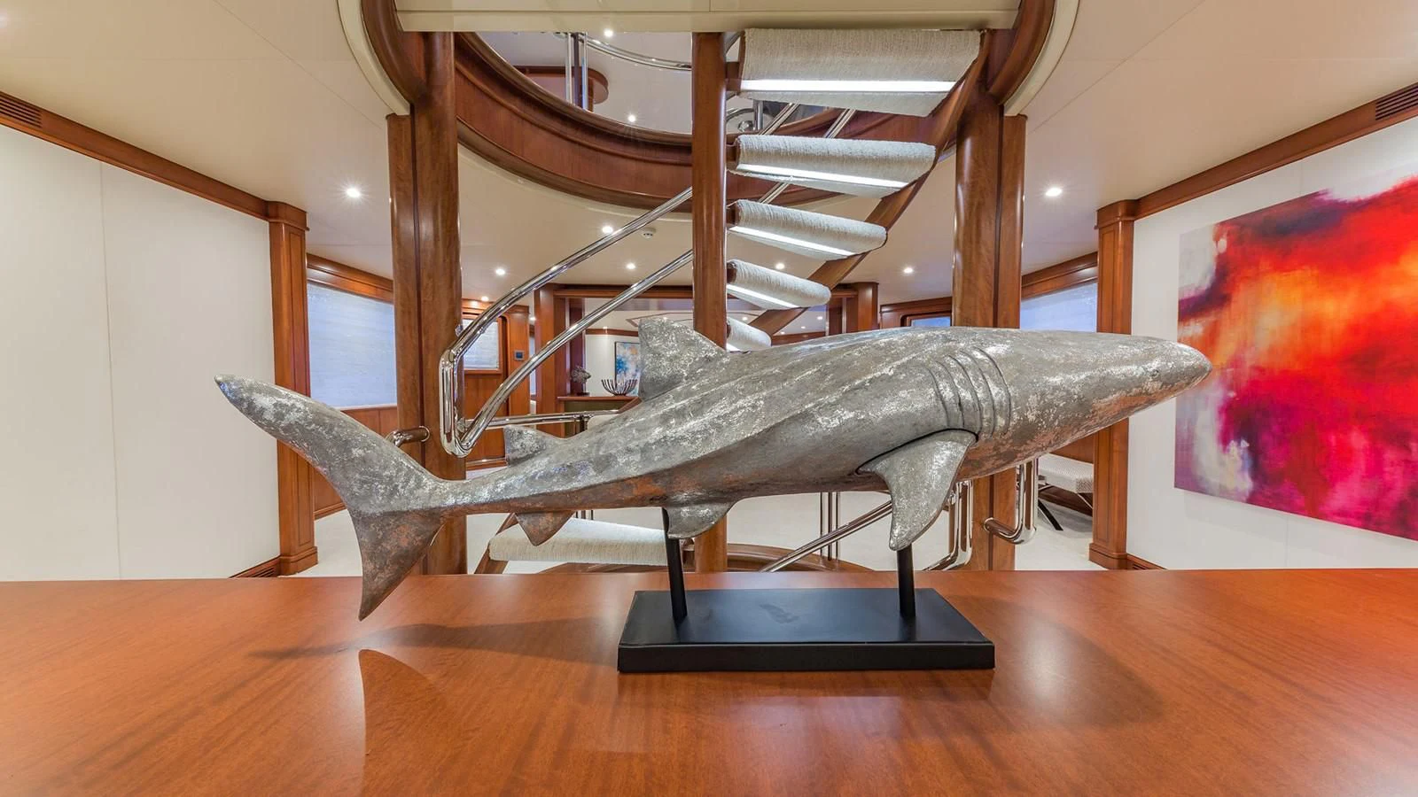 a wooden spiral staircase aboard AT LAST Yacht for Charter