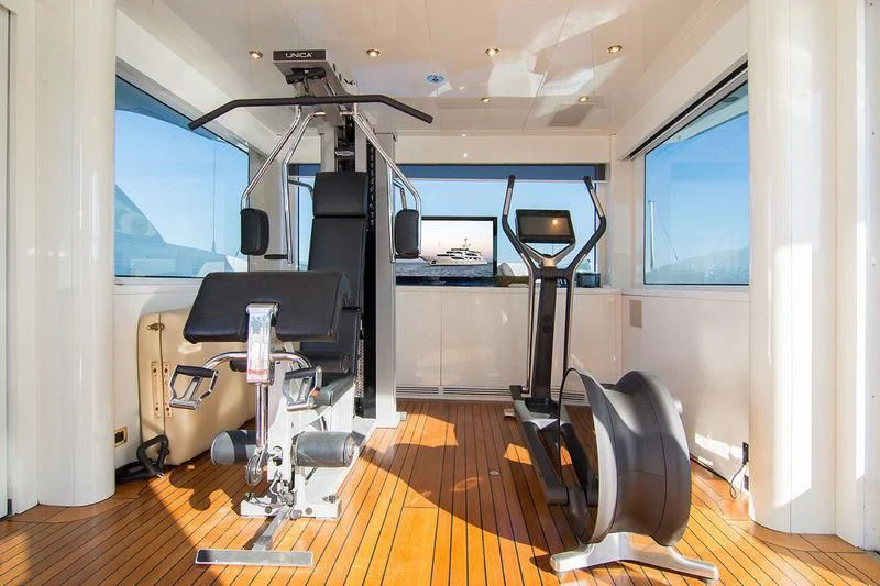 a room with a treadmill and treadmills aboard ZEFZAF Yacht for Sale