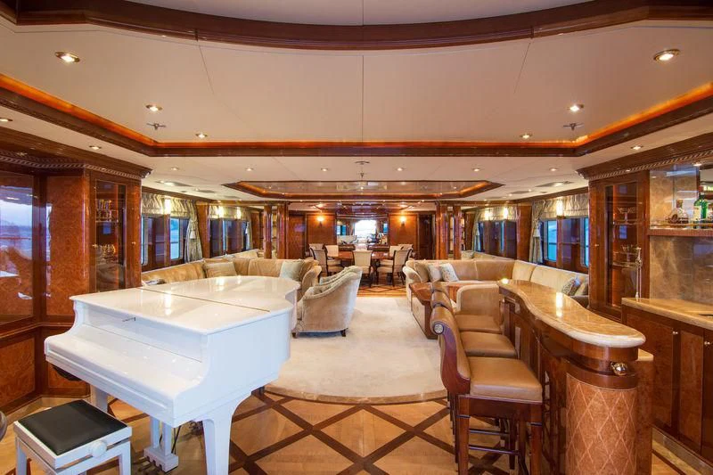 a large room with a table and chairs aboard ZEFZAF Yacht for Sale