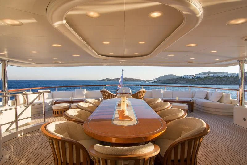 a room with a table and chairs aboard ZEFZAF Yacht for Sale