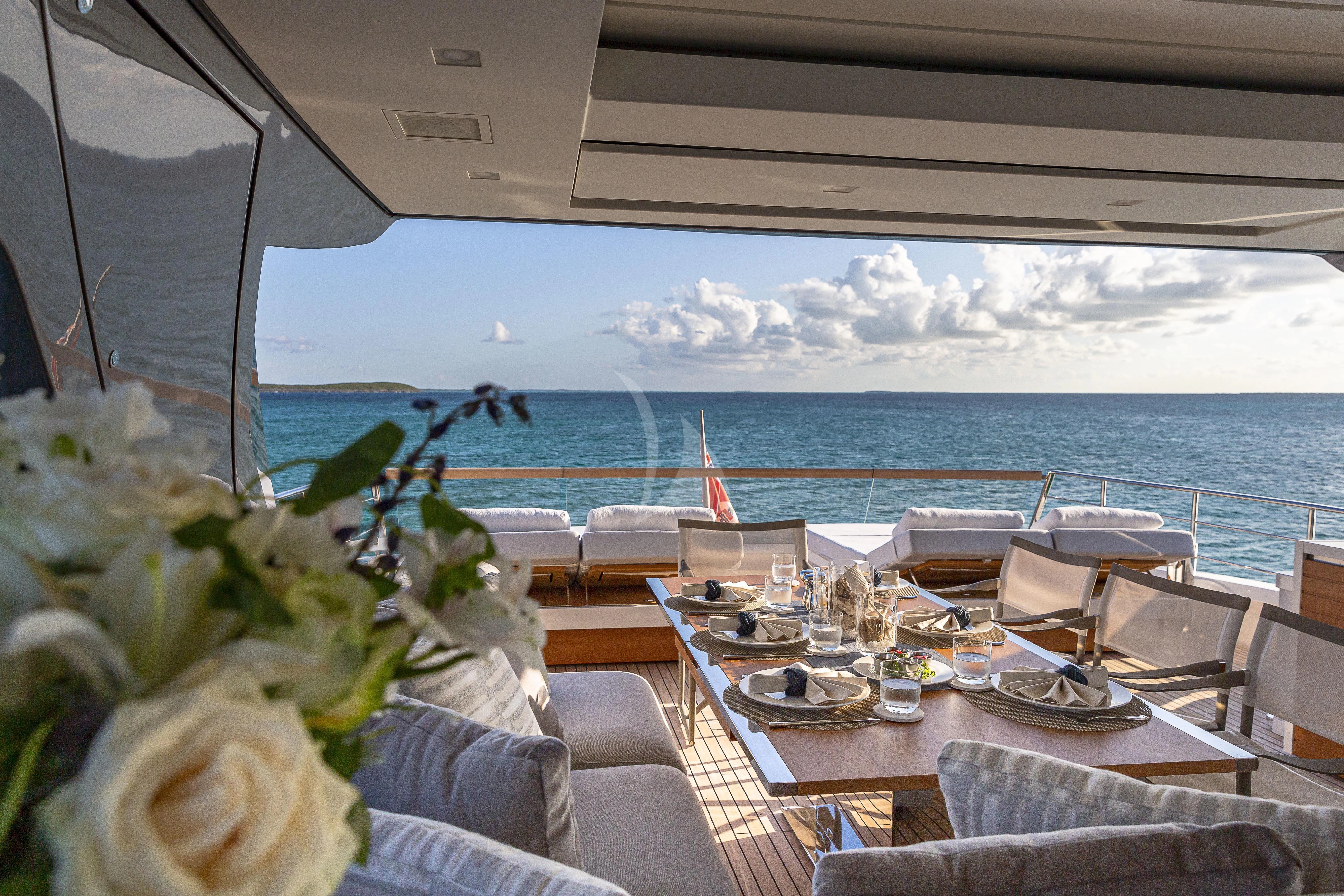 a table set for a meal on a boat aboard NO MATTER WHAT Yacht for Charter
