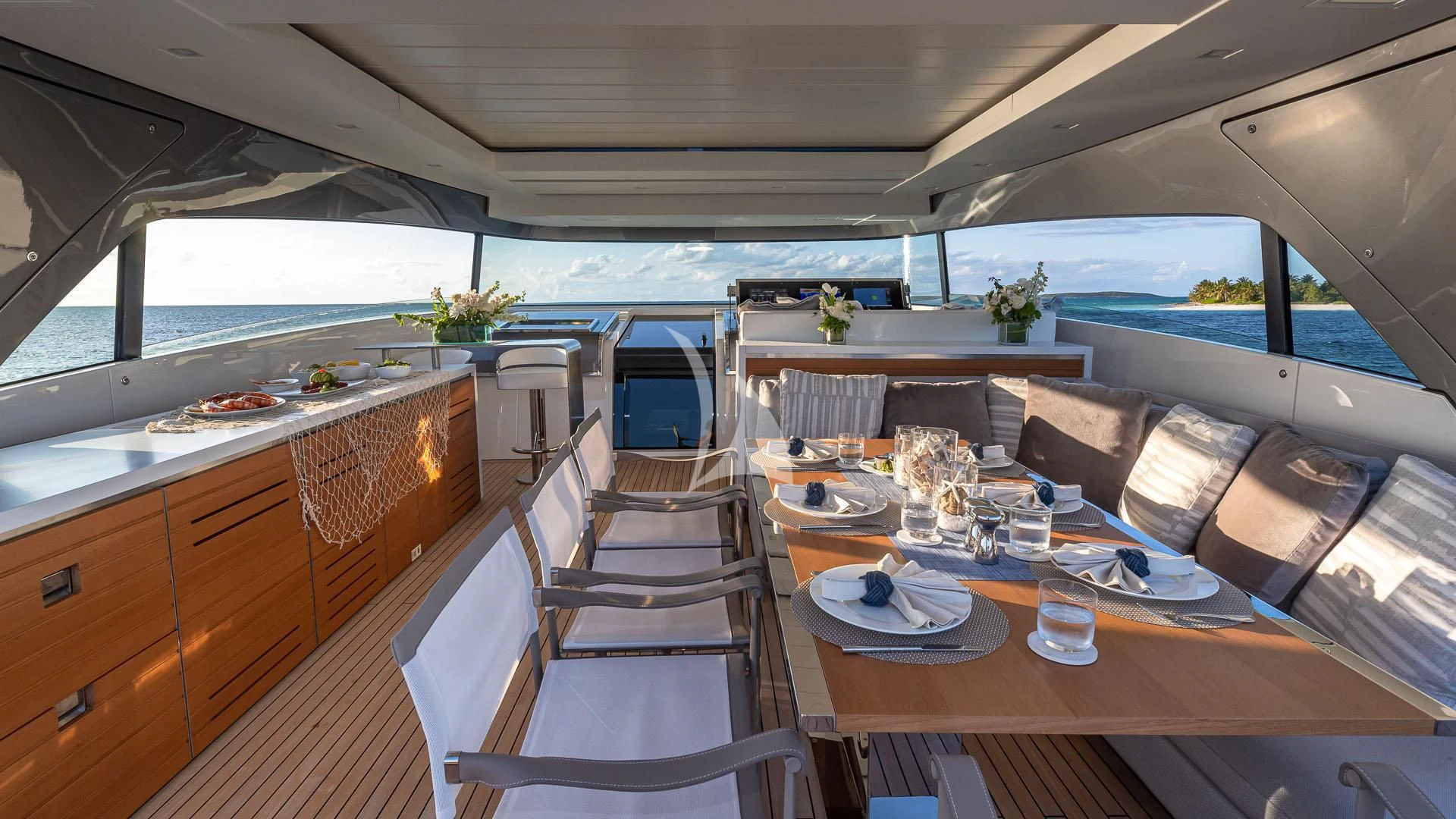 a large kitchen with a dining table aboard NO MATTER WHAT Yacht for Charter