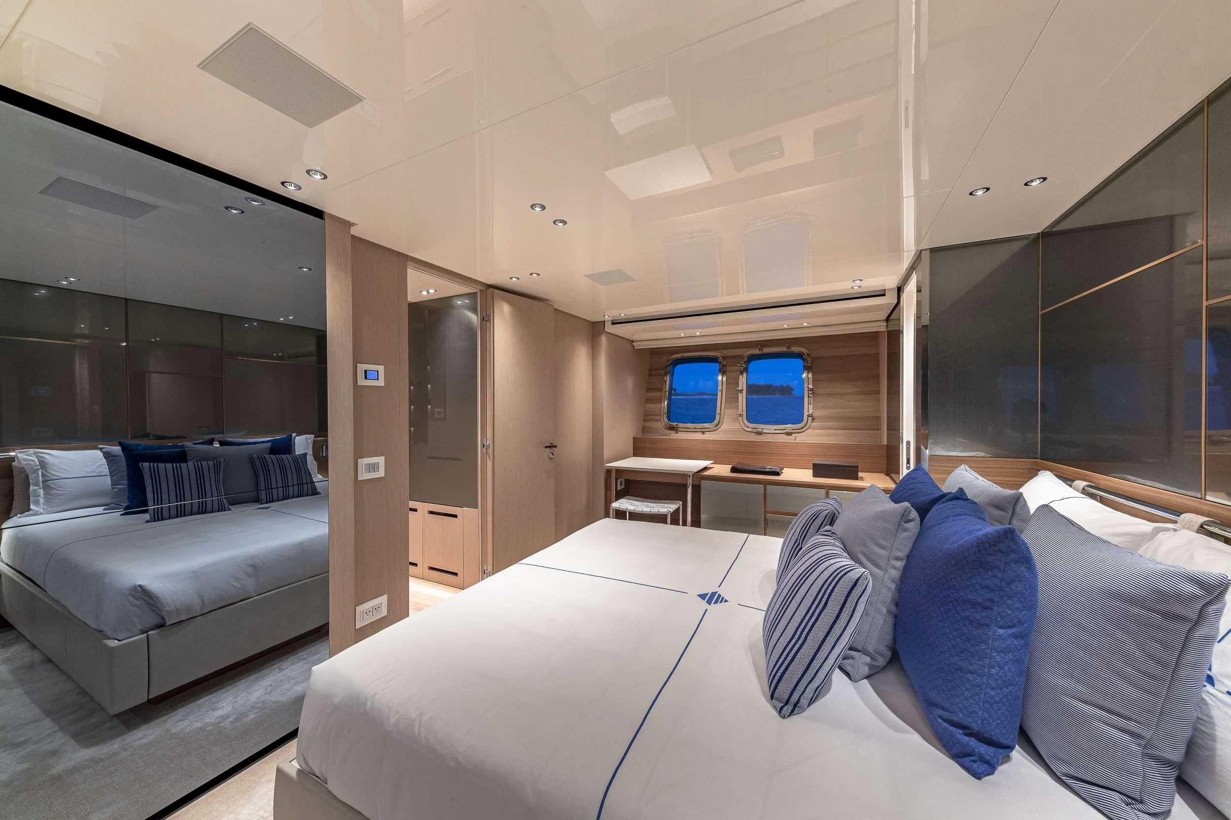 a room with a bed and a couch aboard NO MATTER WHAT Yacht for Charter