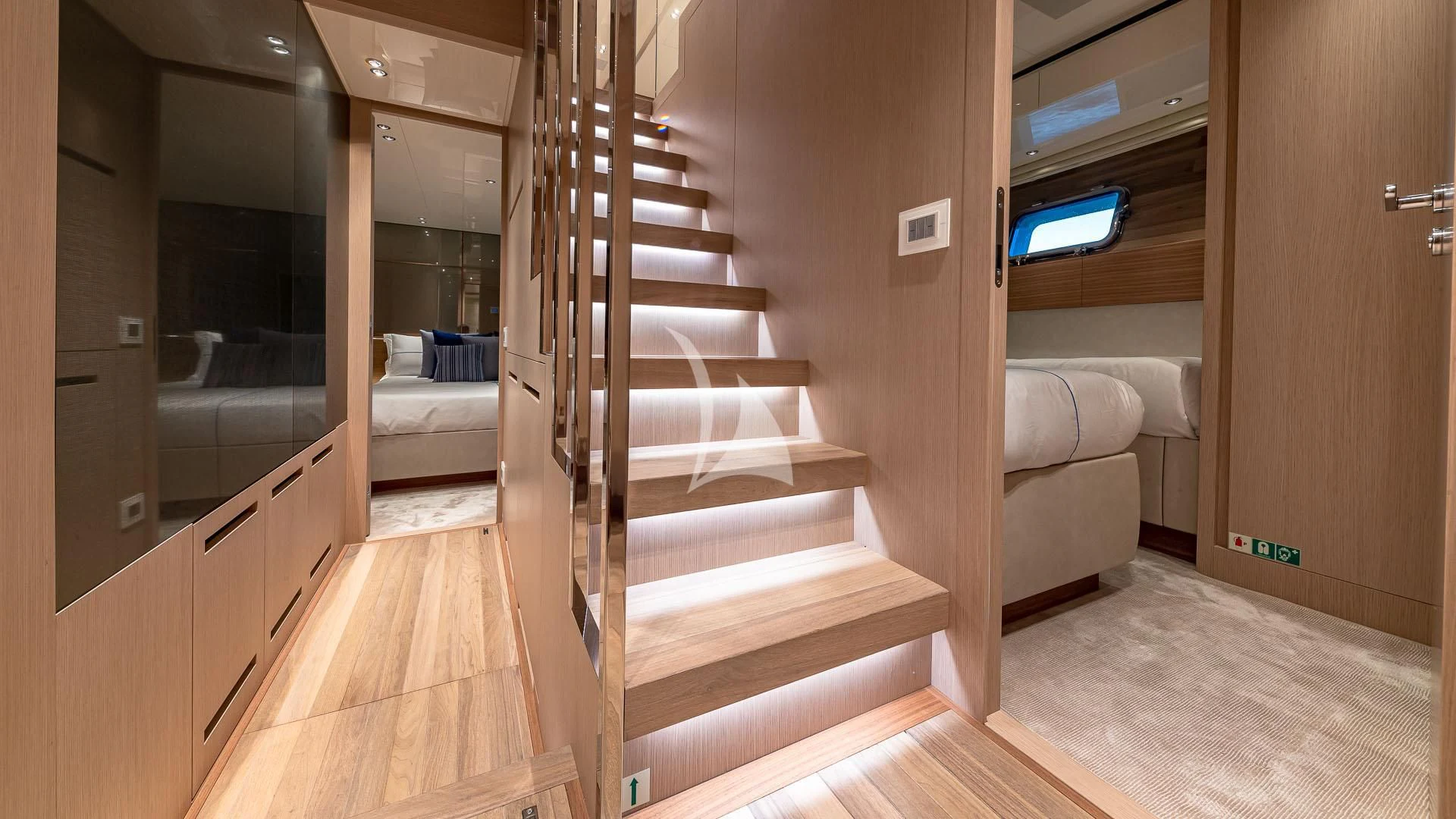 a room with a bed and a couch aboard NO MATTER WHAT Yacht for Charter