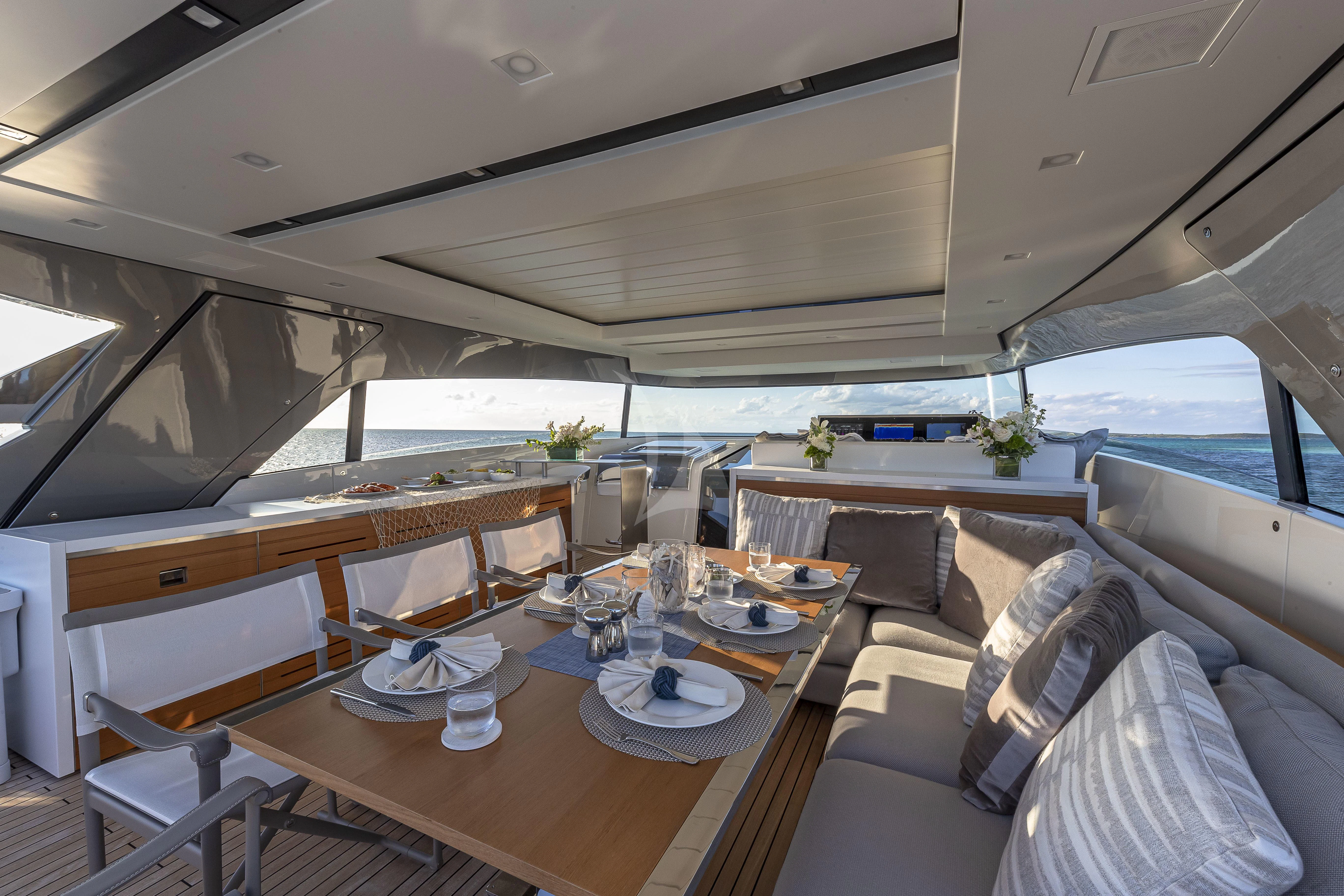 a room with a table and chairs aboard NO MATTER WHAT Yacht for Charter