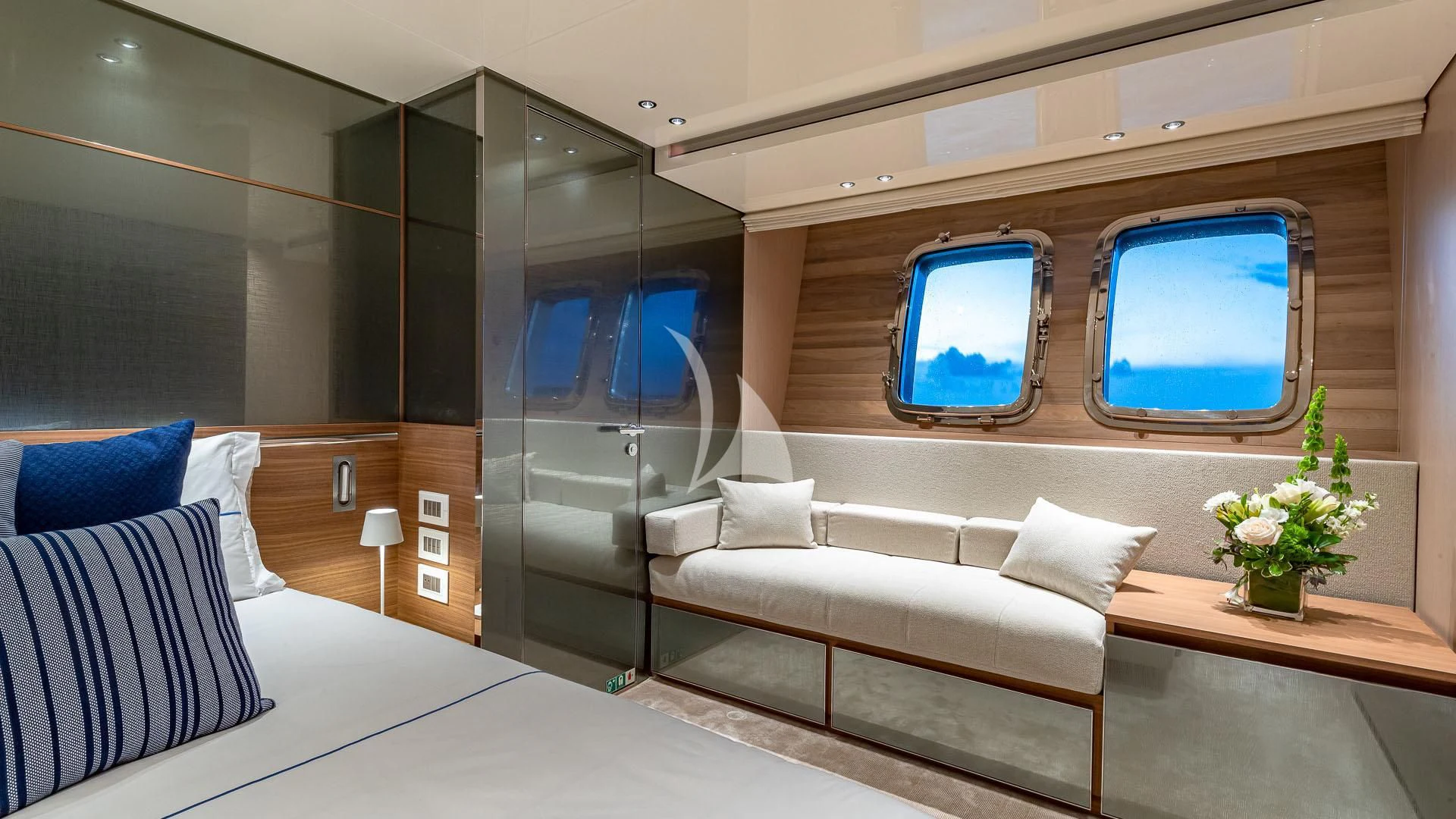 a room with a bed and a window aboard NO MATTER WHAT Yacht for Charter