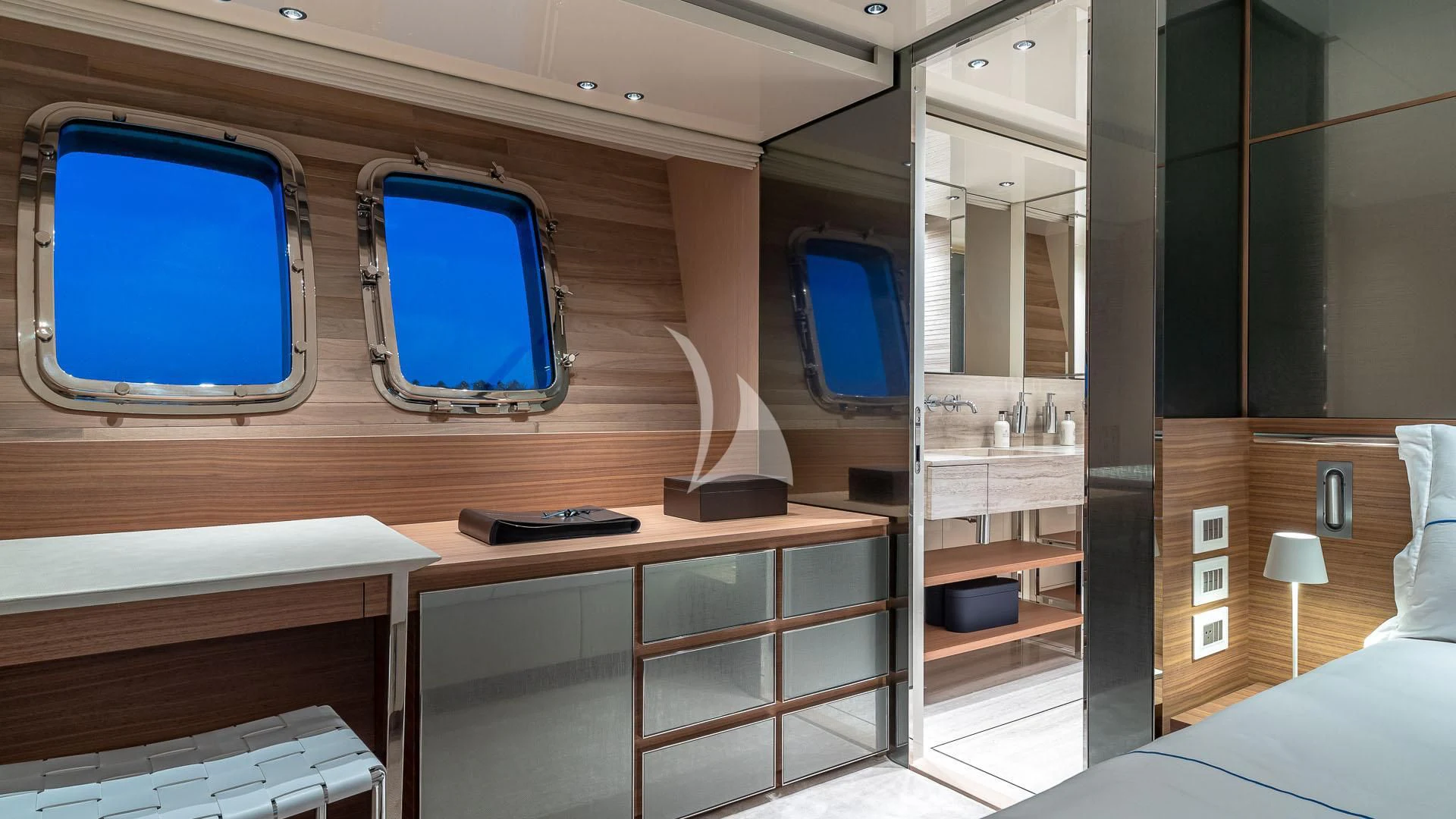 a room with a desk and a bed aboard NO MATTER WHAT Yacht for Charter